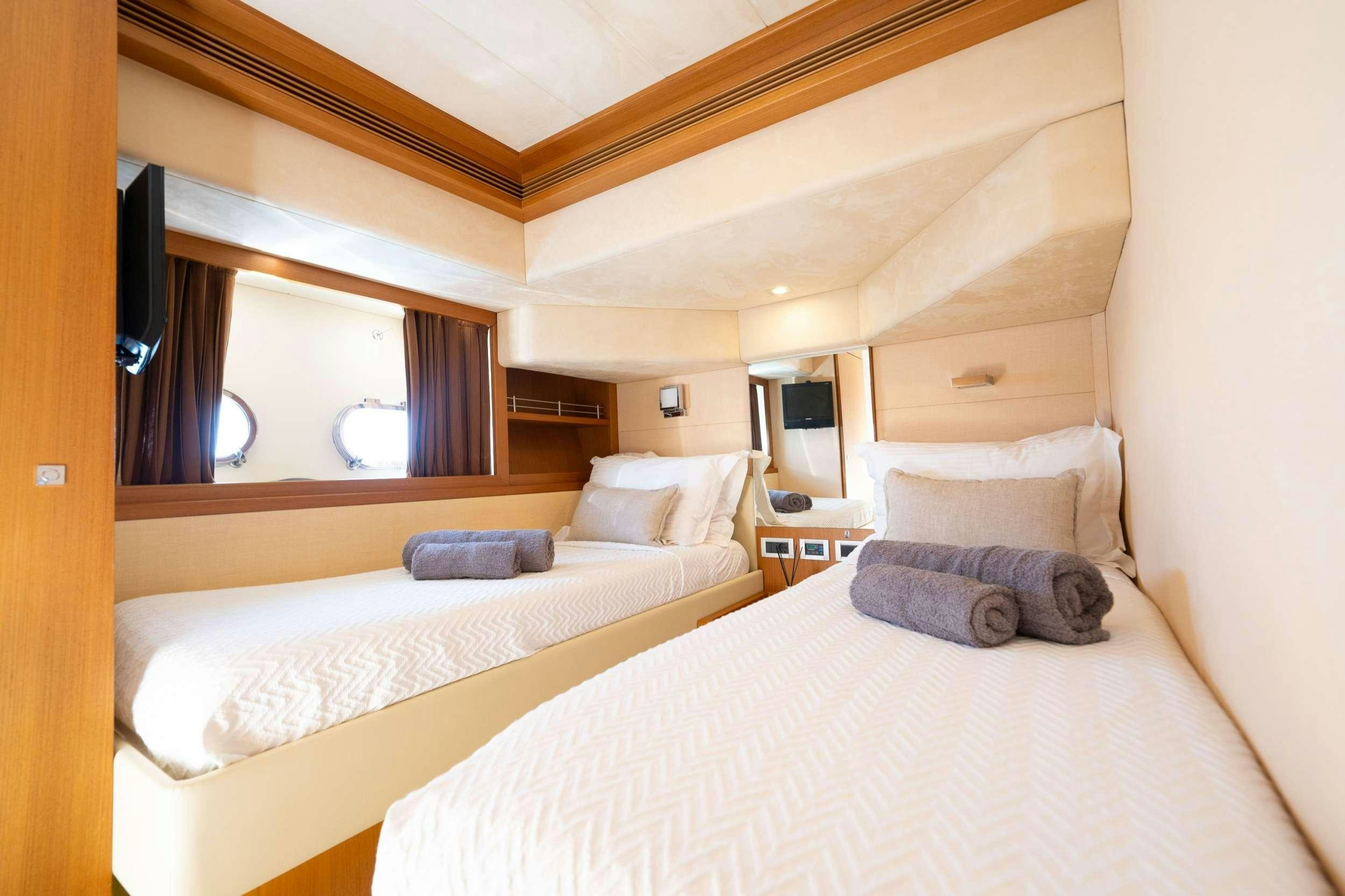 a room with two beds aboard NINETEEN Yacht for Charter