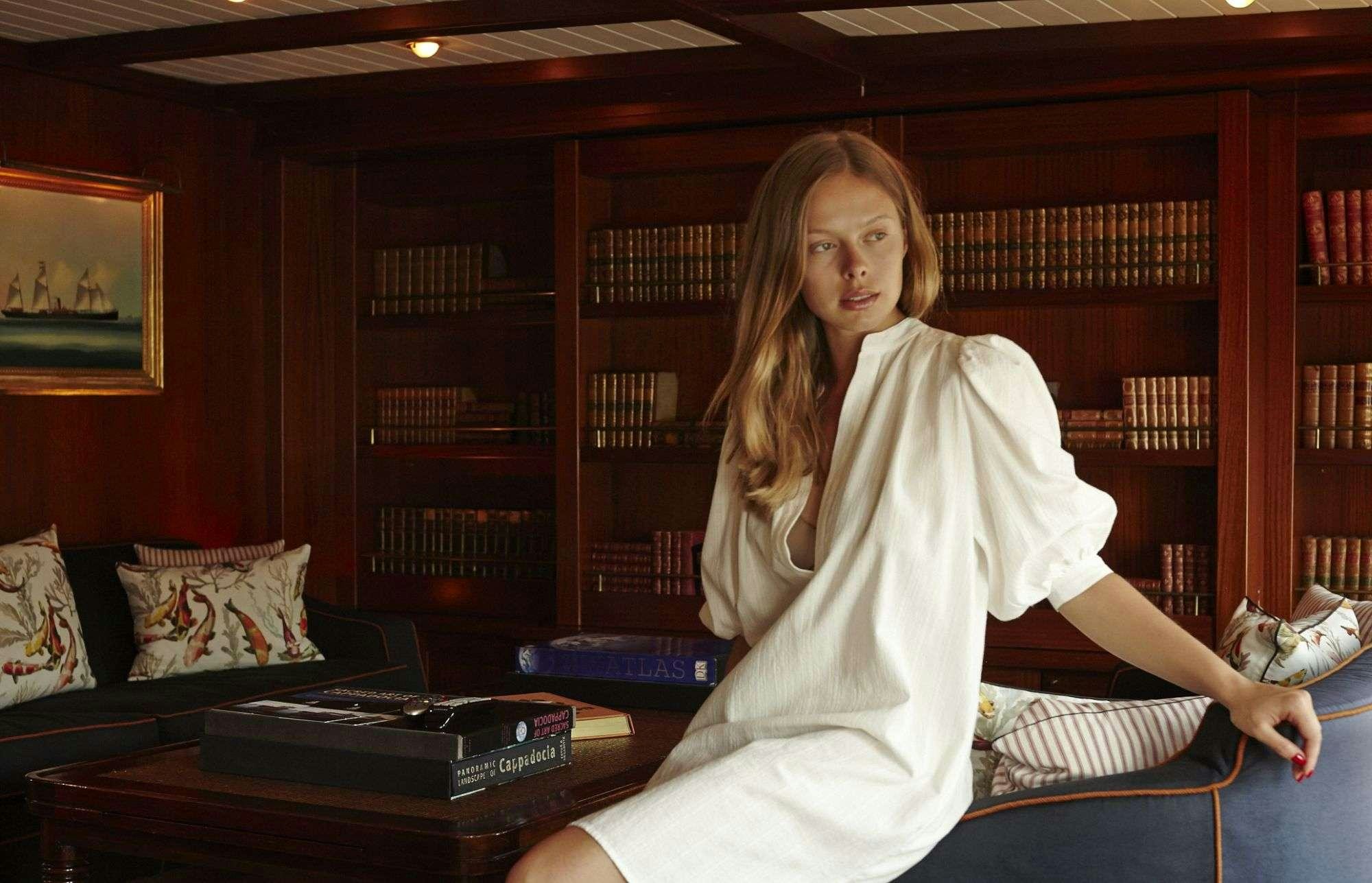 a person in a white dress aboard HALAS 71 Yacht for Charter