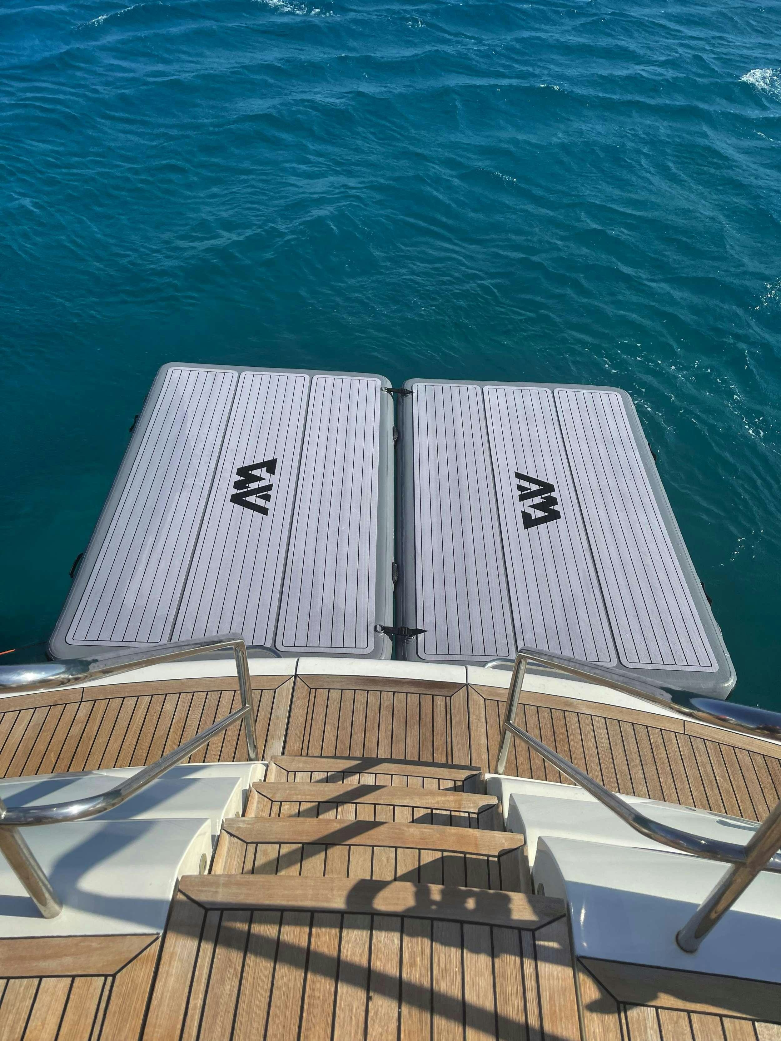 a large white boat with a deck aboard VENUS Yacht for Charter