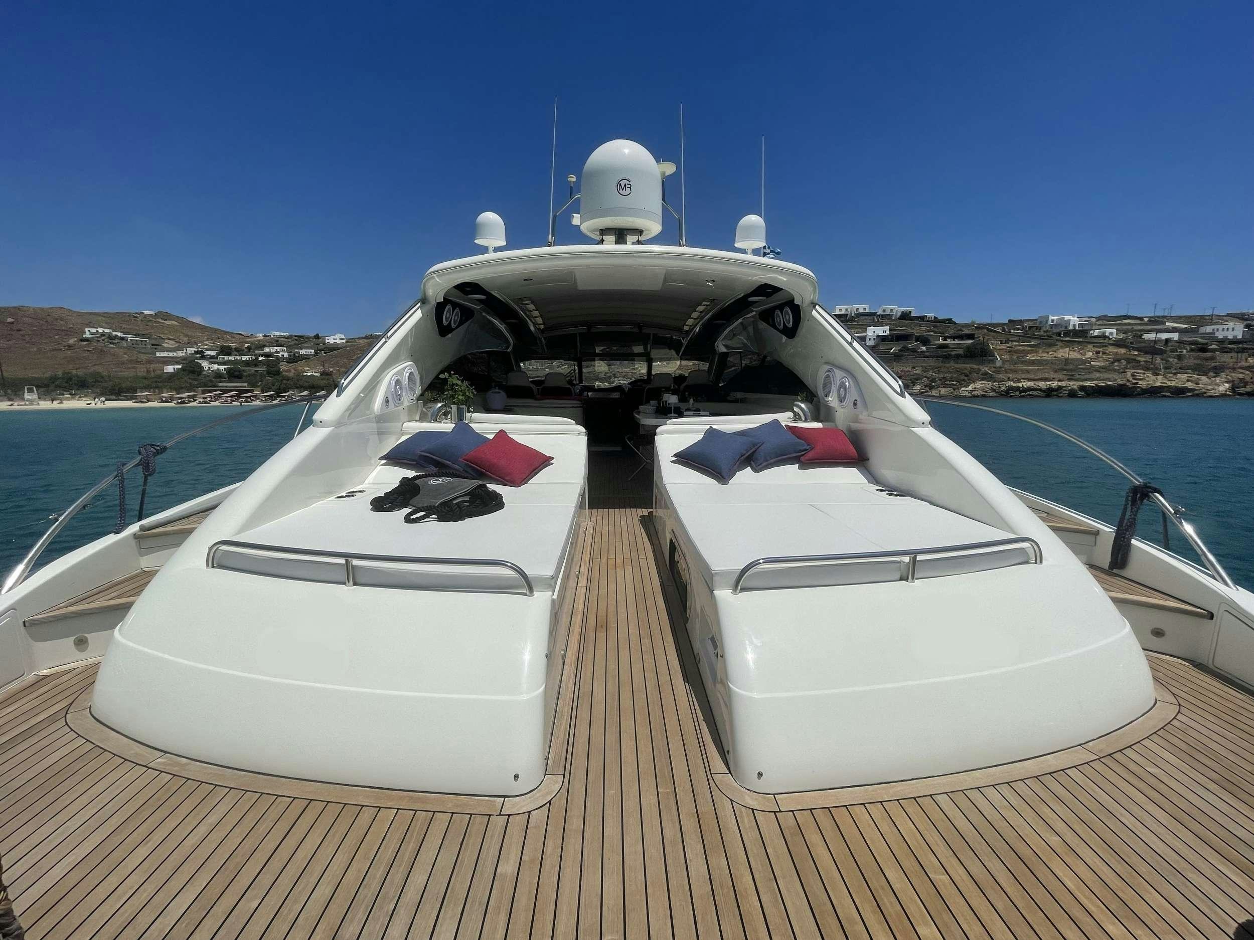 a white yacht on a deck aboard VENUS Yacht for Charter