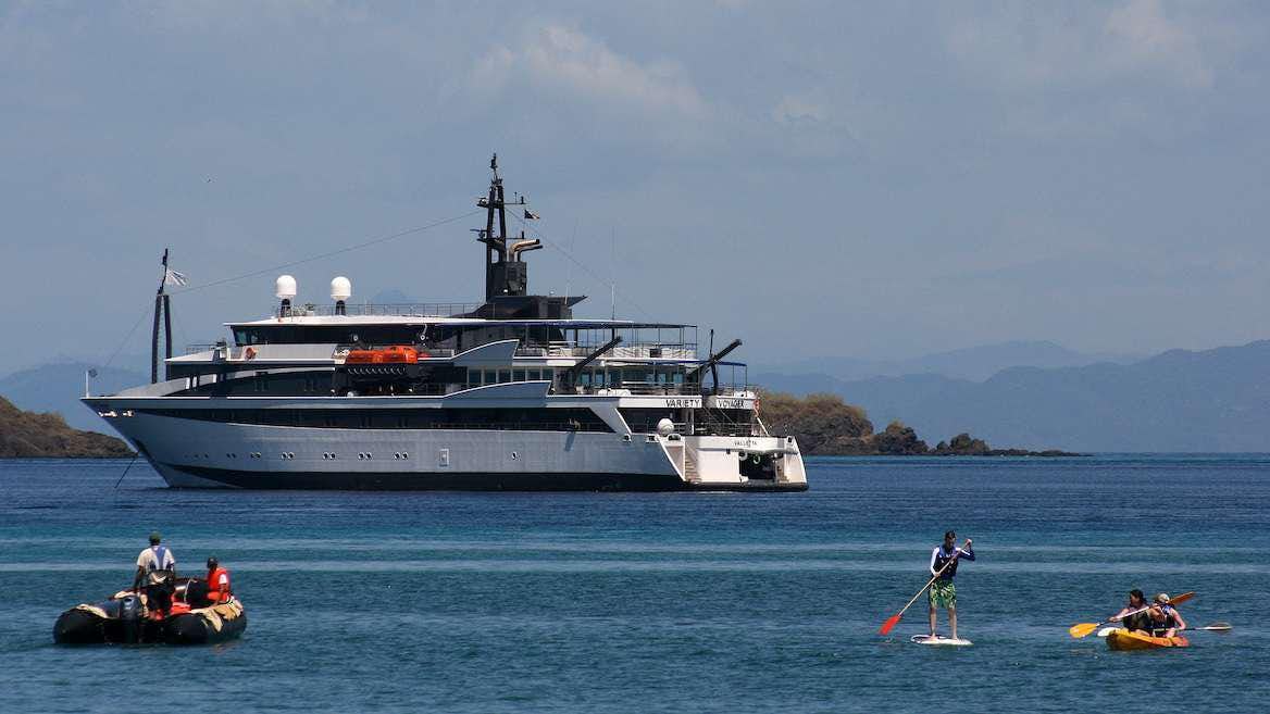 a large ship in the water aboard VARIETY VOYAGER Yacht for Charter