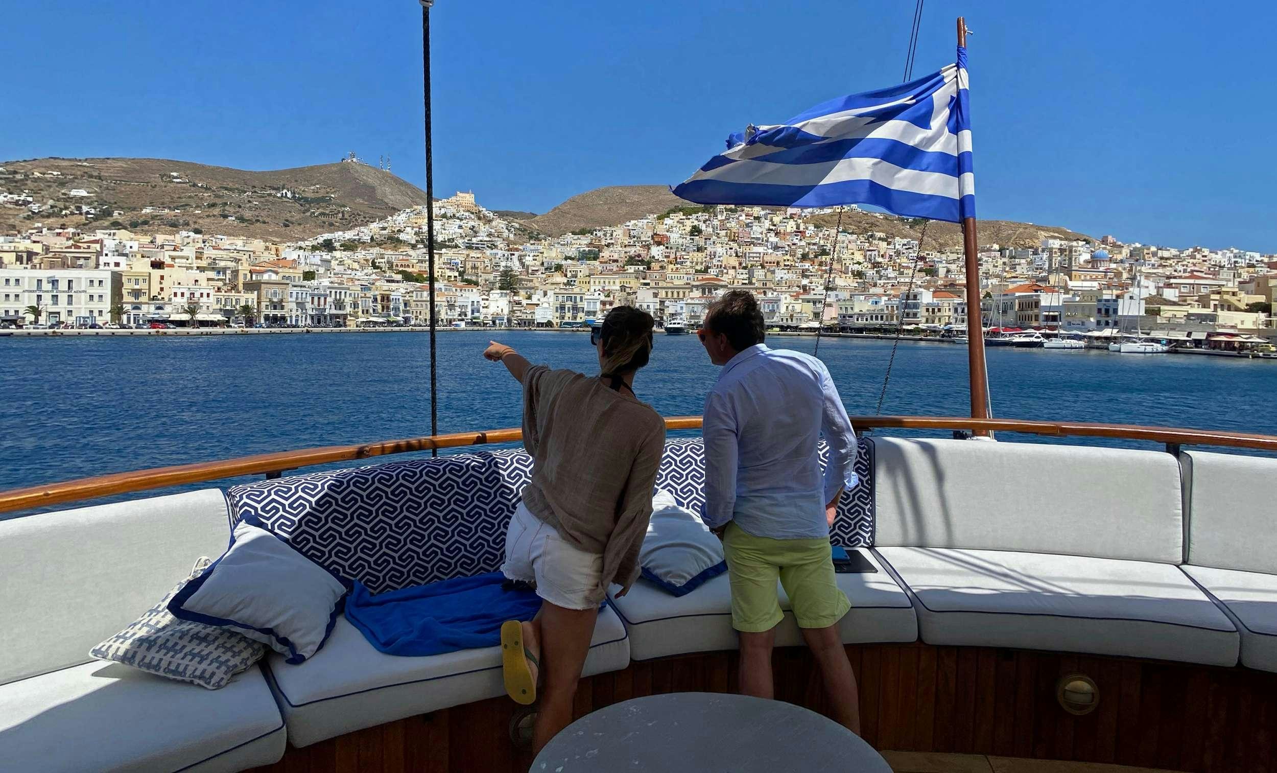 a couple of people on a boat aboard GALILEO Yacht for Charter