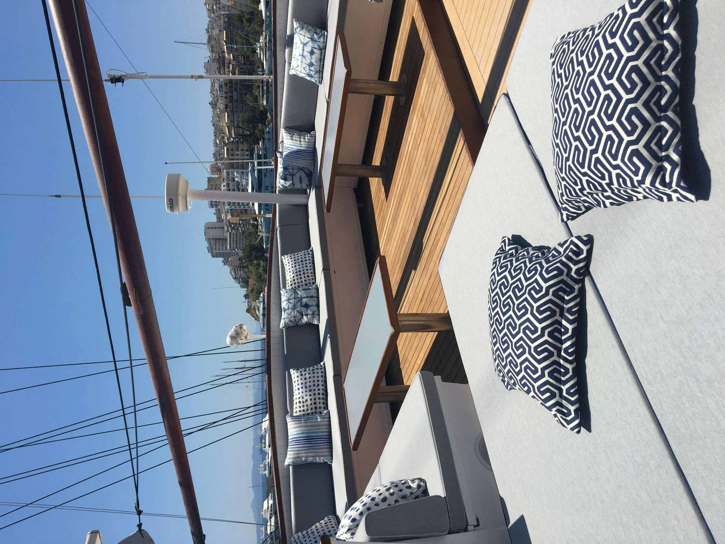 a building with a flag and a sign on the wall aboard GALILEO Yacht for Charter