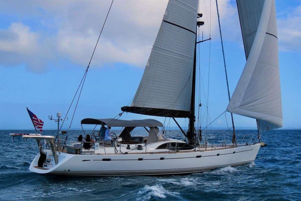 a boat sailing on the sea aboard AEGIS Yacht for Charter
