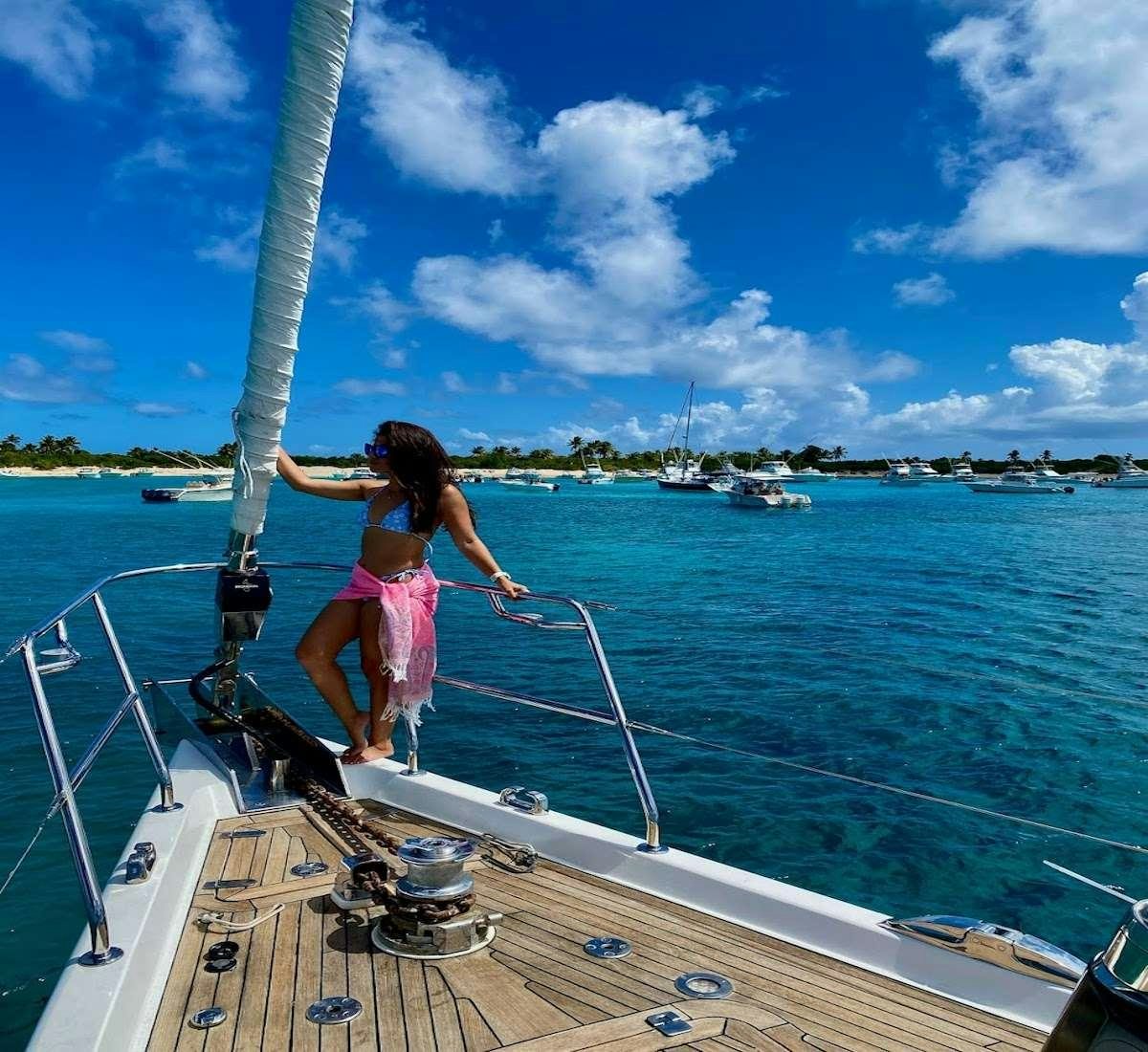 a man standing on a boat aboard AEGIS Yacht for Charter