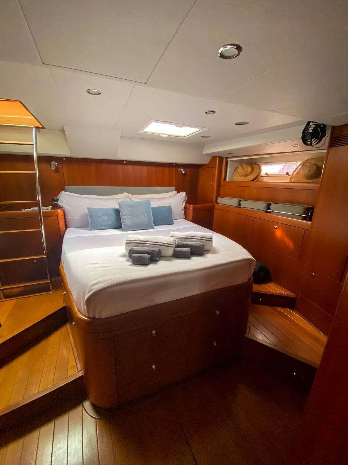 a bed in a room aboard AEGIS Yacht for Charter