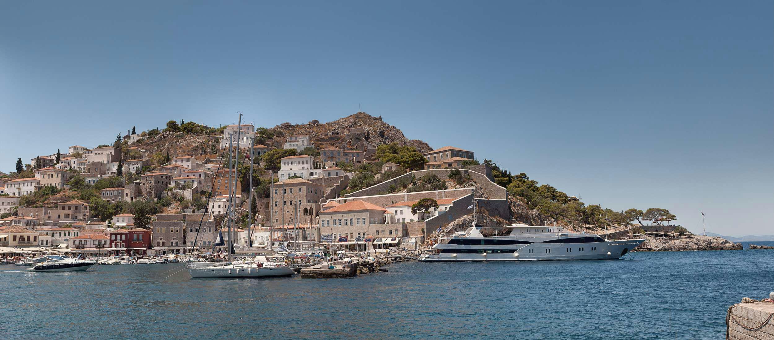 a city on a hill aboard HARMONY V Yacht for Charter