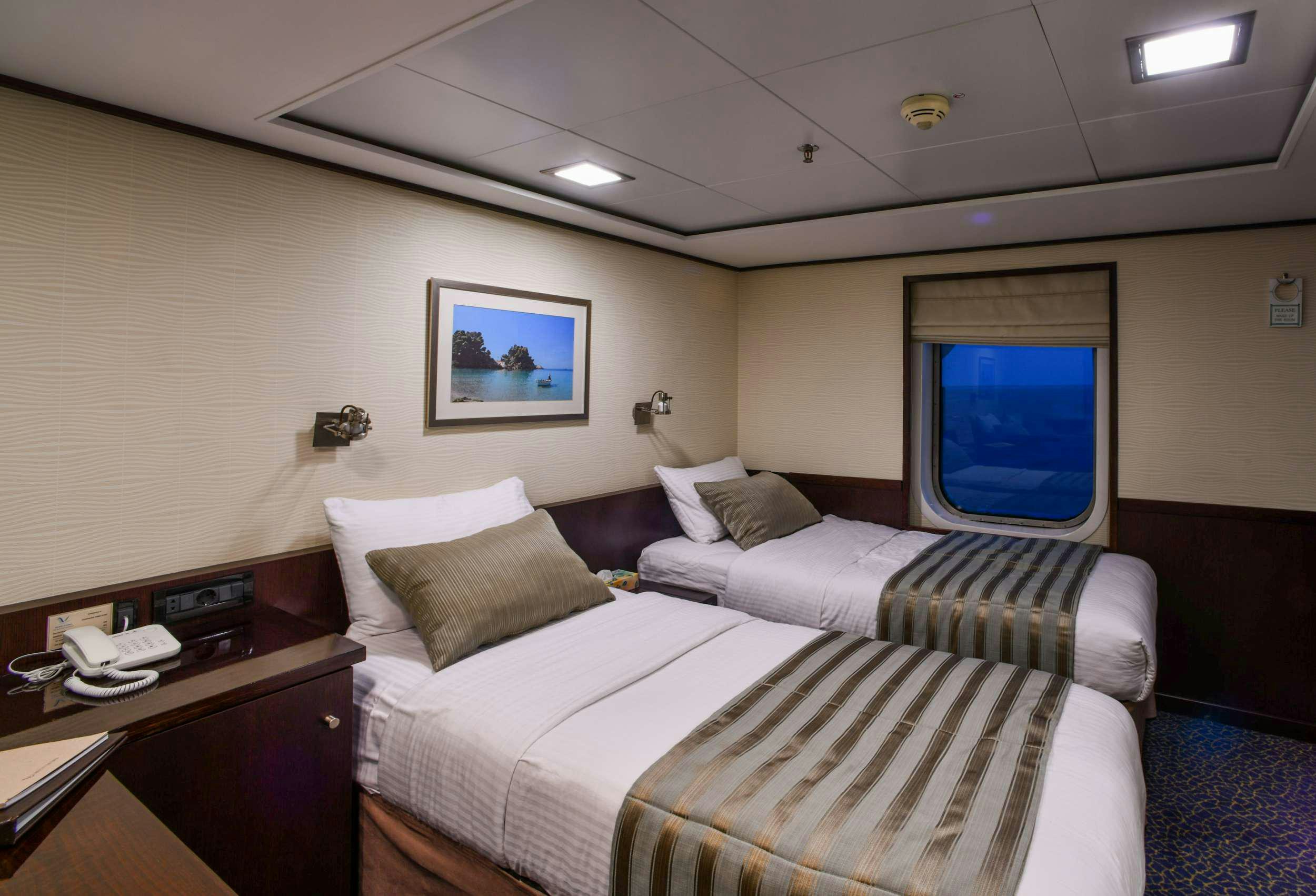 a room with two beds aboard HARMONY V Yacht for Charter