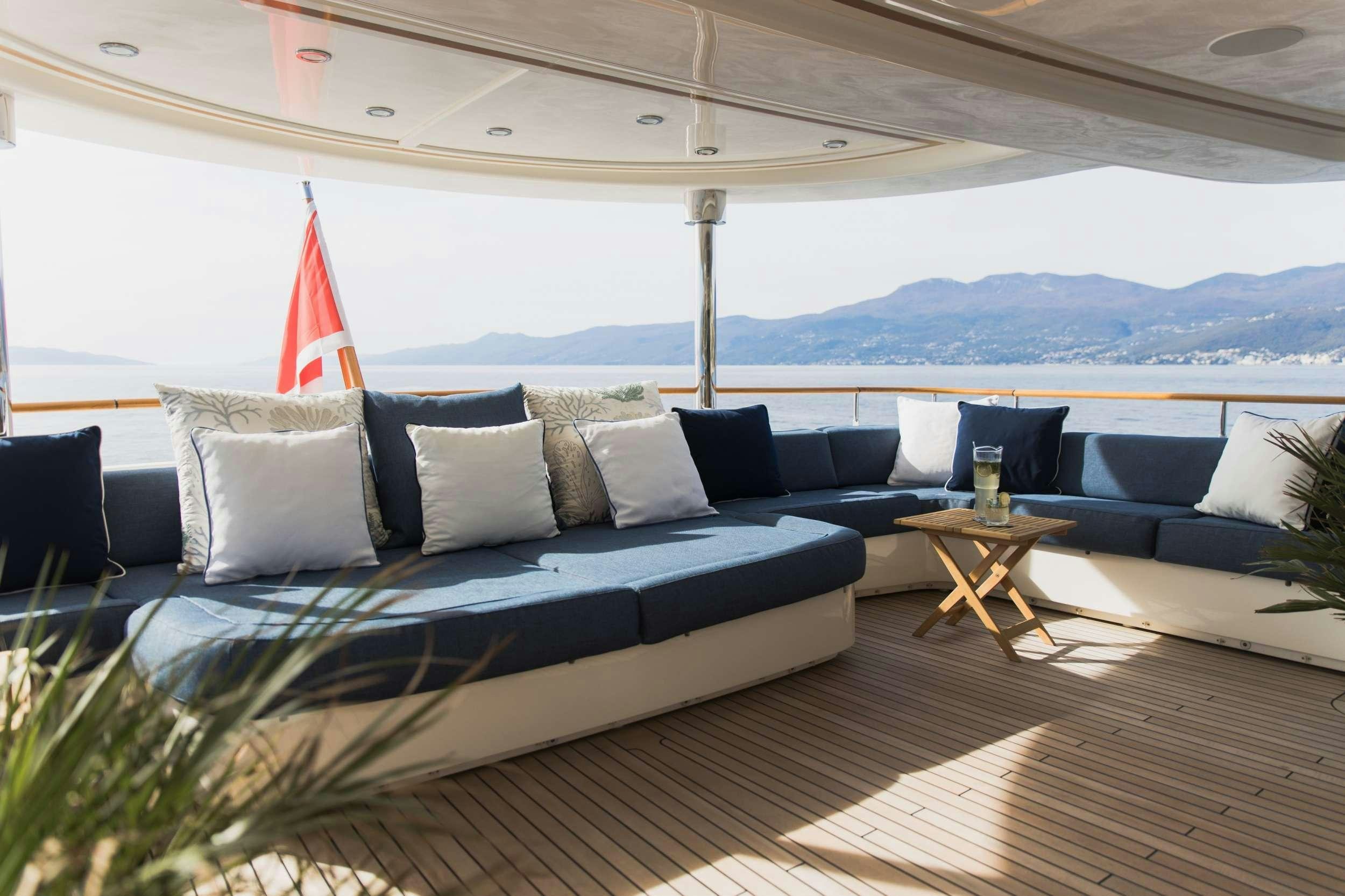 a large bed with pillows aboard LADY TRUDY Yacht for Charter