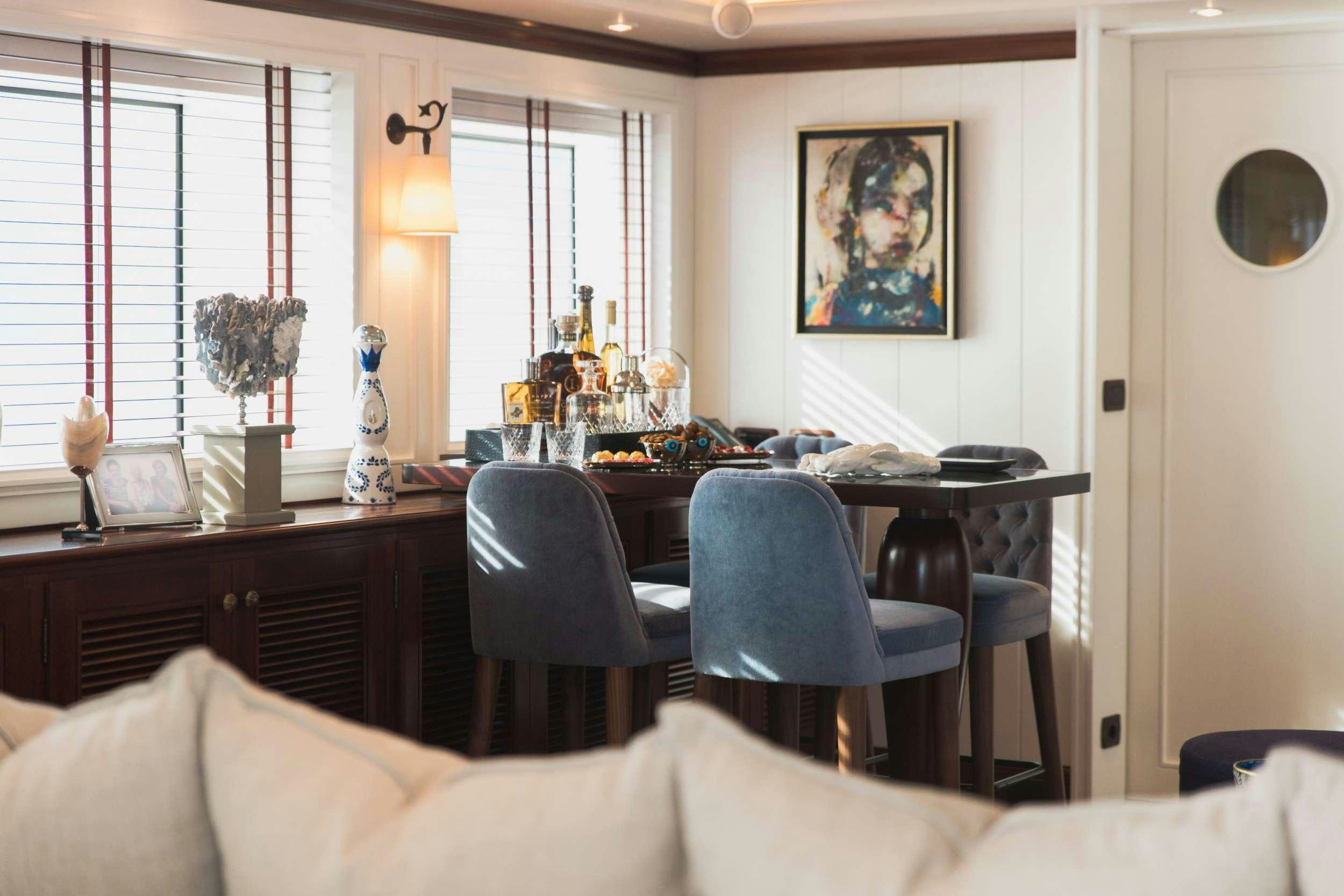 a living room with a piano aboard LADY TRUDY Yacht for Charter