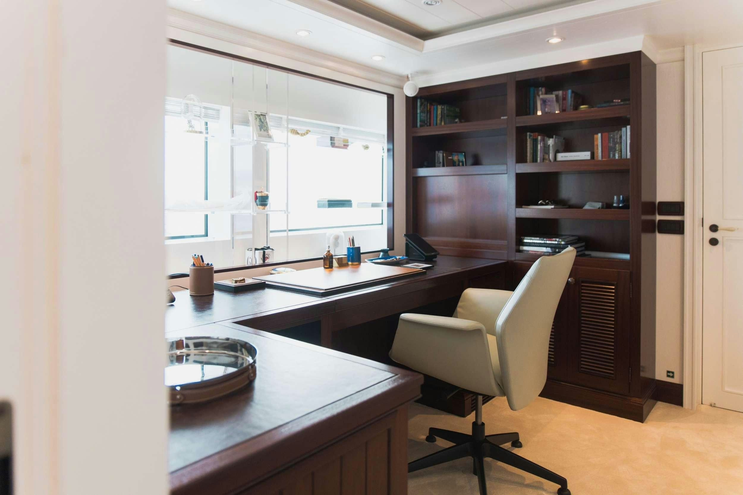a room with a desk and a chair aboard LADY TRUDY Yacht for Charter