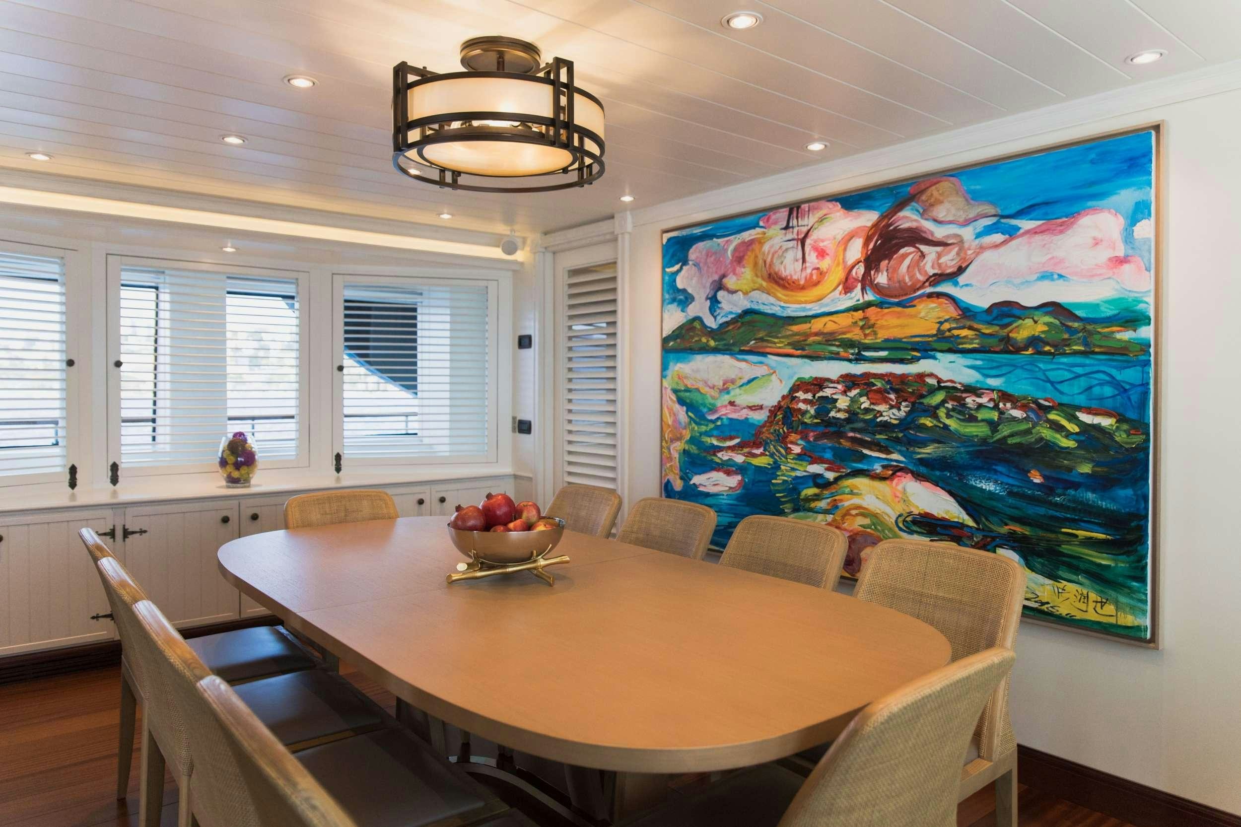 a large room with a large painting on the wall aboard LADY TRUDY Yacht for Charter