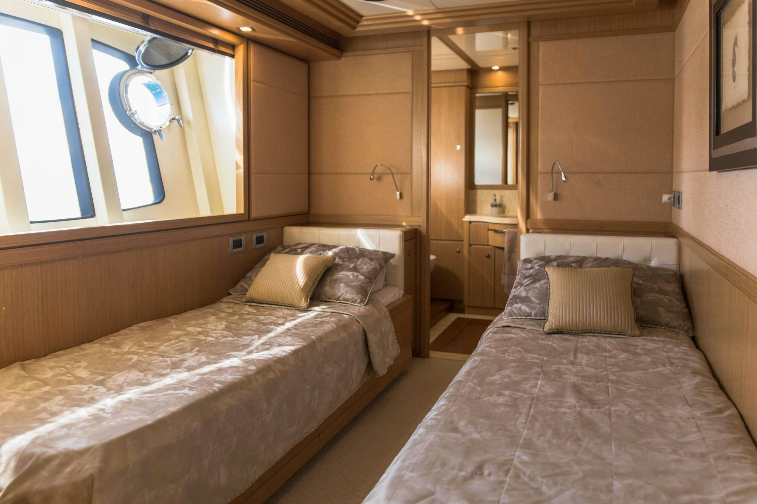 a couple of beds in a room aboard FRIEND'S BOAT Yacht for Charter