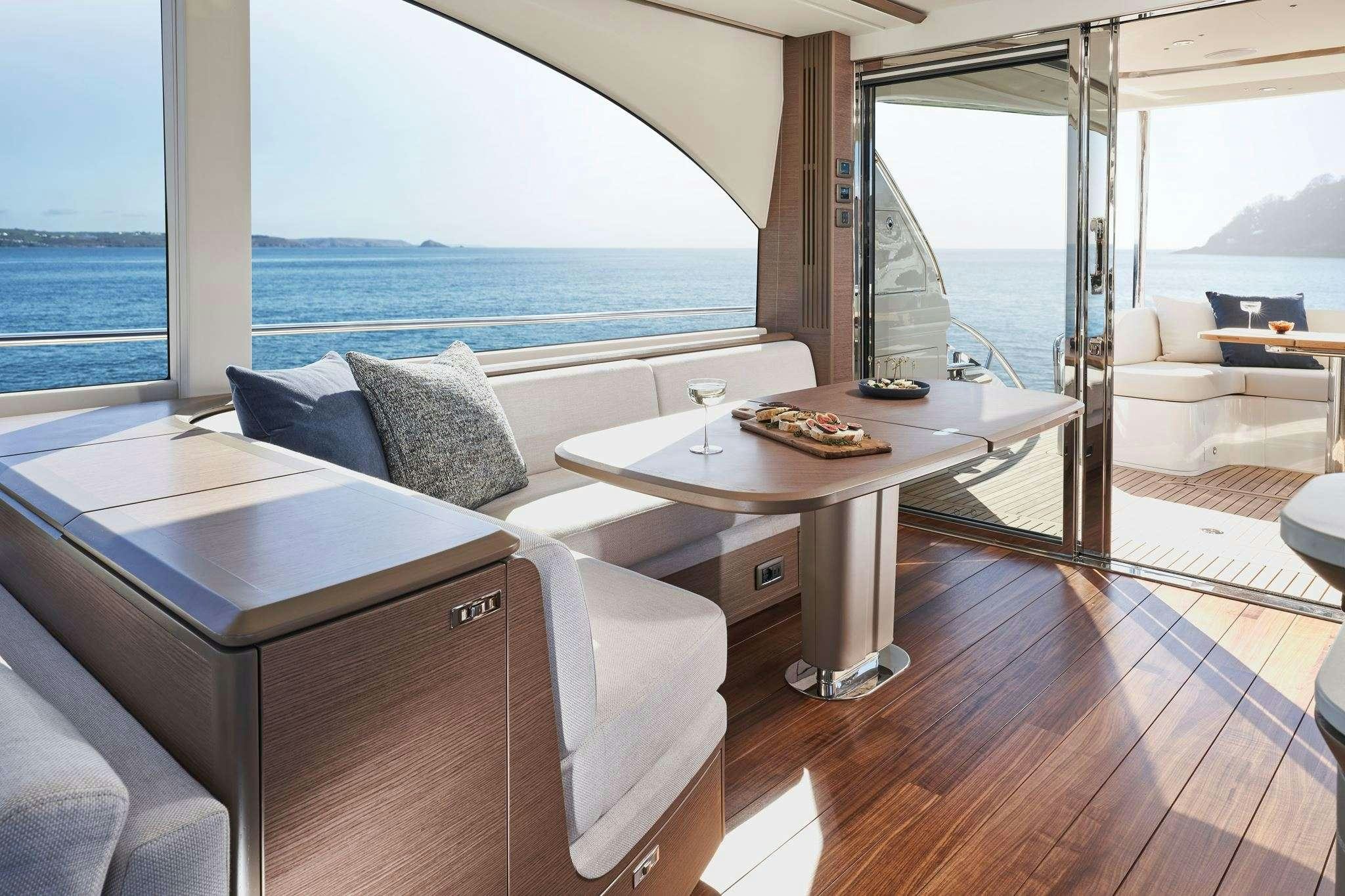 a room with a table and chairs aboard ELIZABETH Yacht for Charter