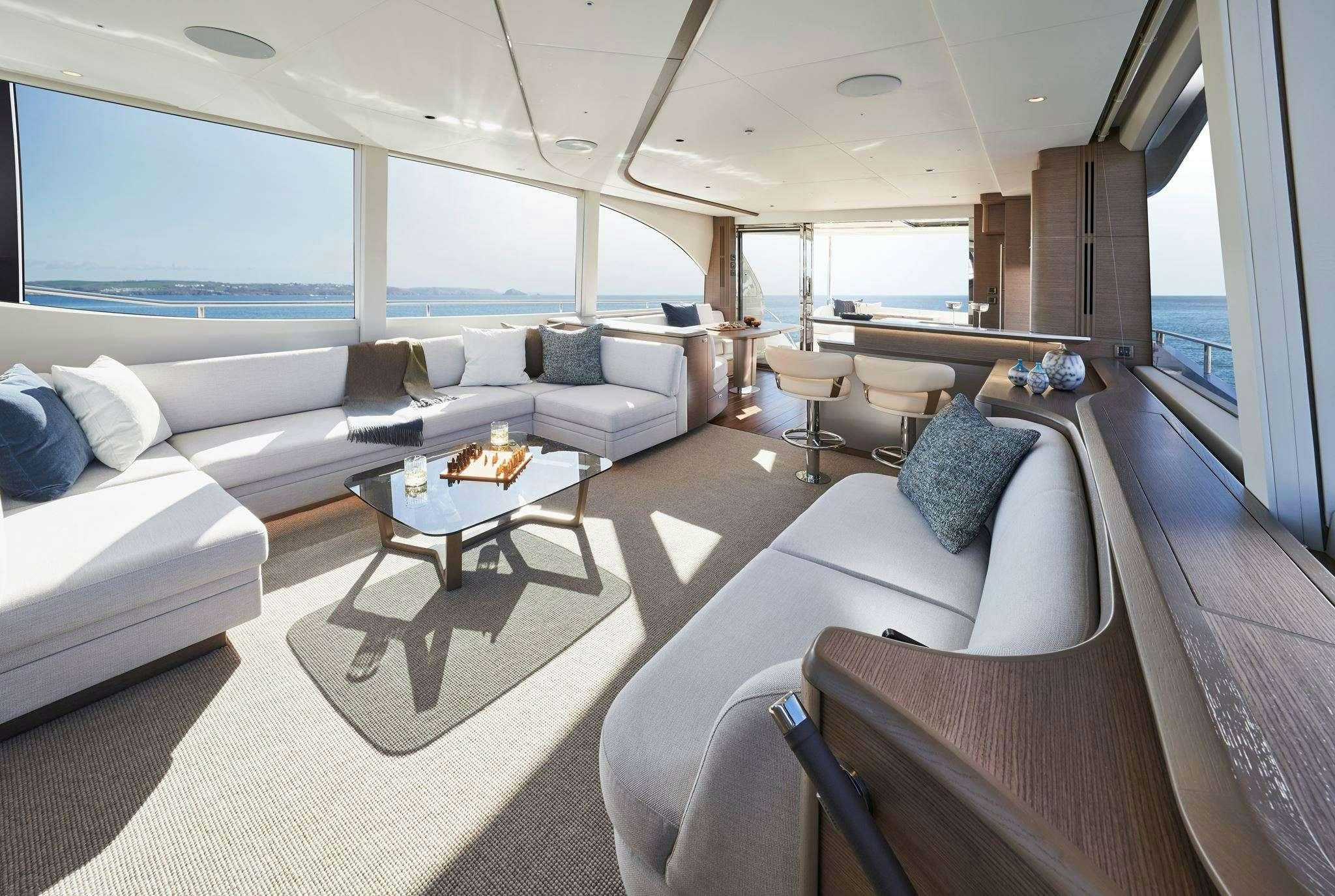a living room with a large window aboard ELIZABETH Yacht for Charter