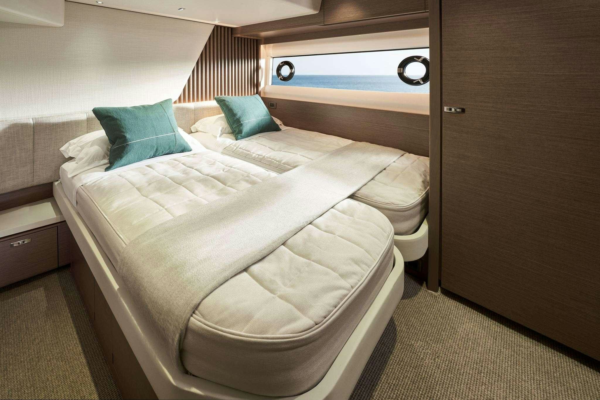 a room with two beds aboard ELIZABETH Yacht for Charter