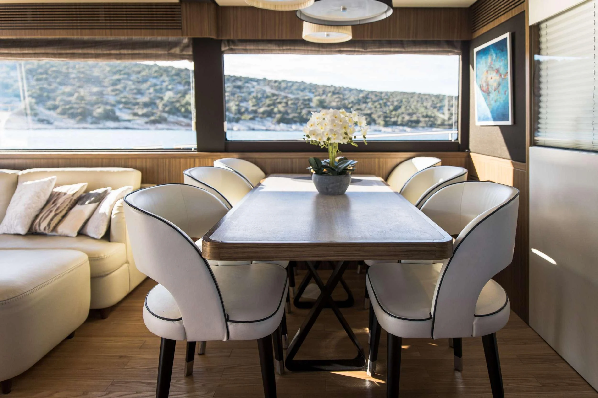 a table and chairs in a room aboard BOLLINGER Yacht for Charter