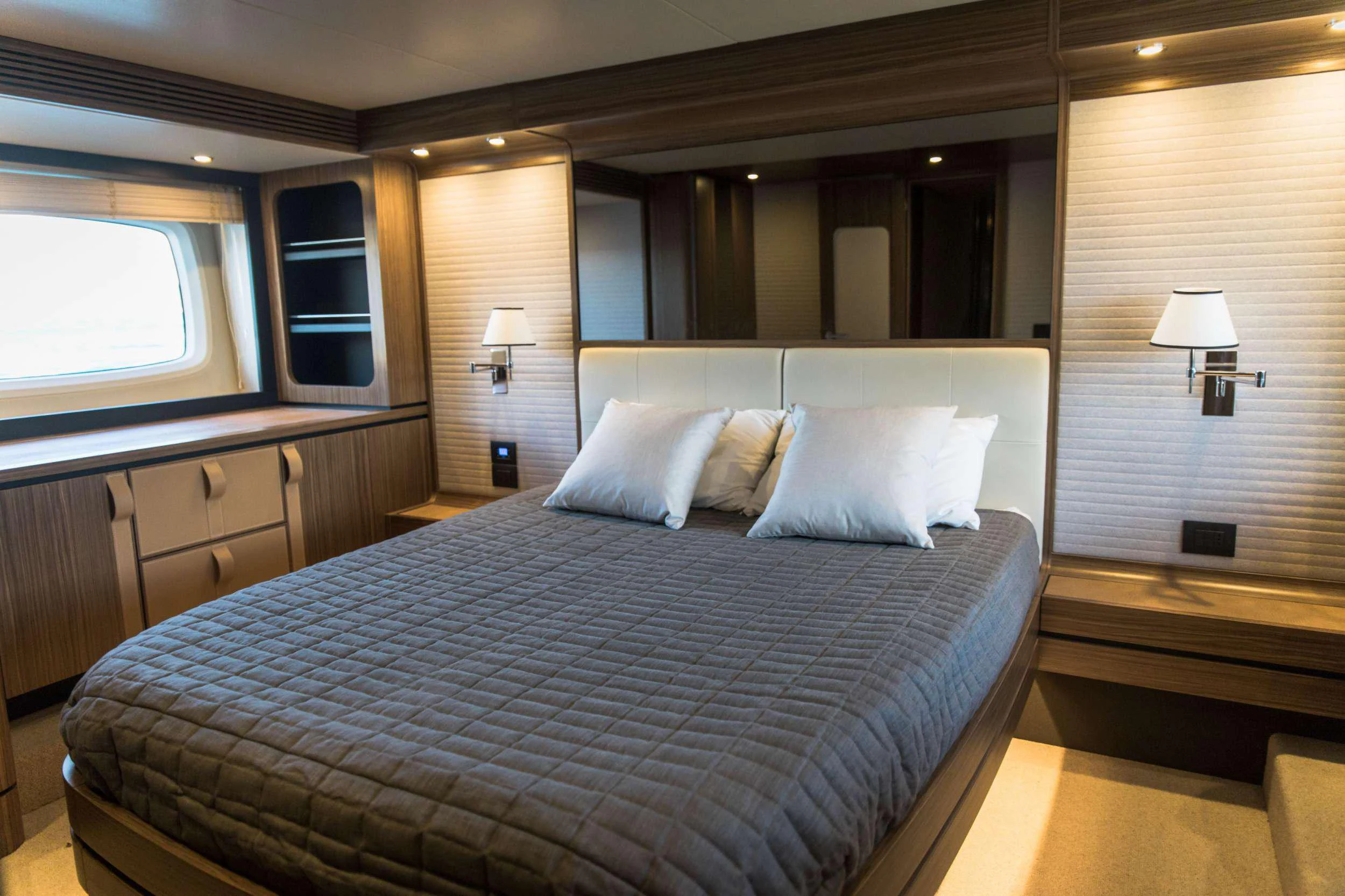 a large bed in a hotel room aboard BOLLINGER Yacht for Charter