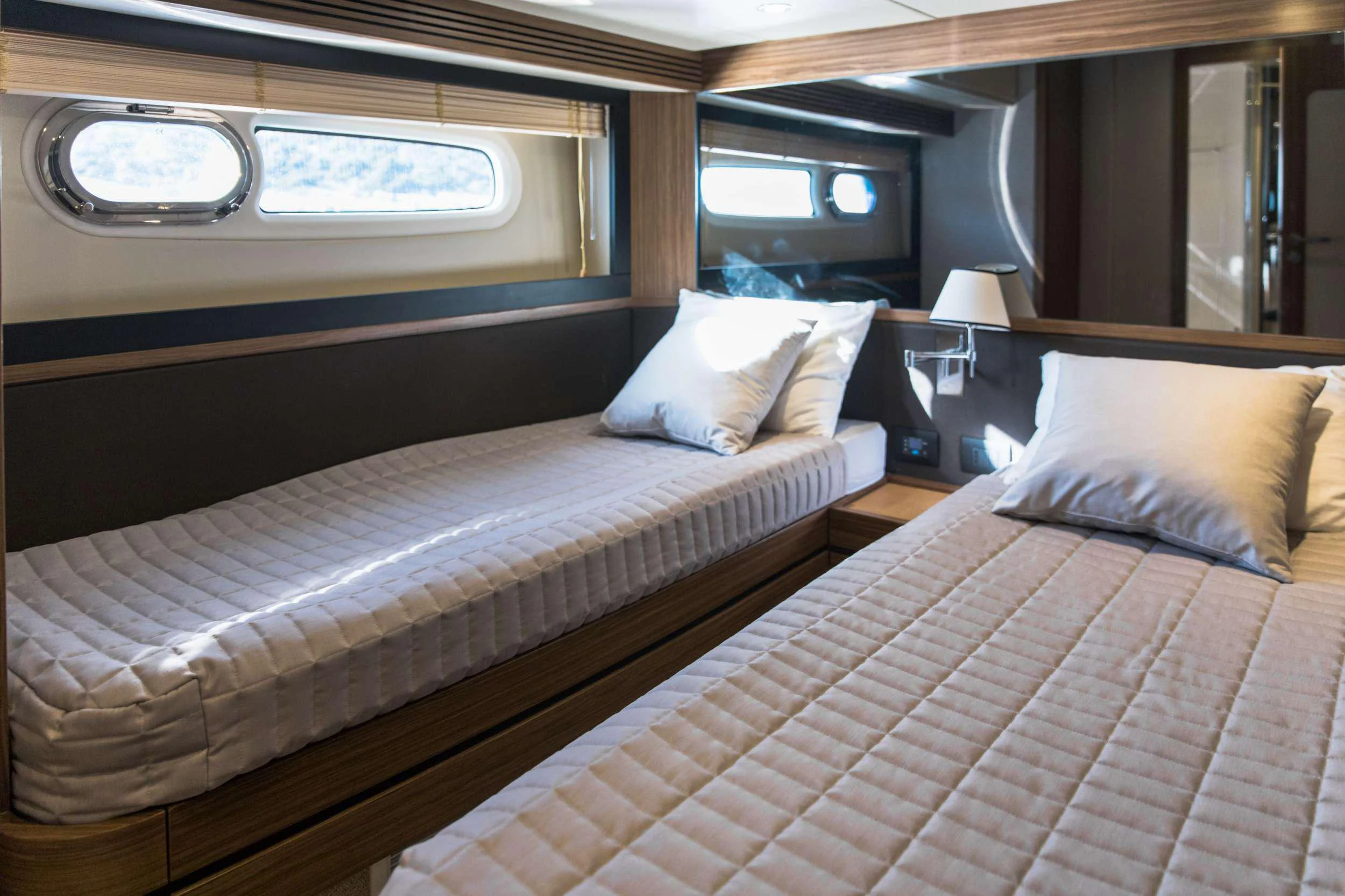 a couple of beds in a room aboard BOLLINGER Yacht for Charter