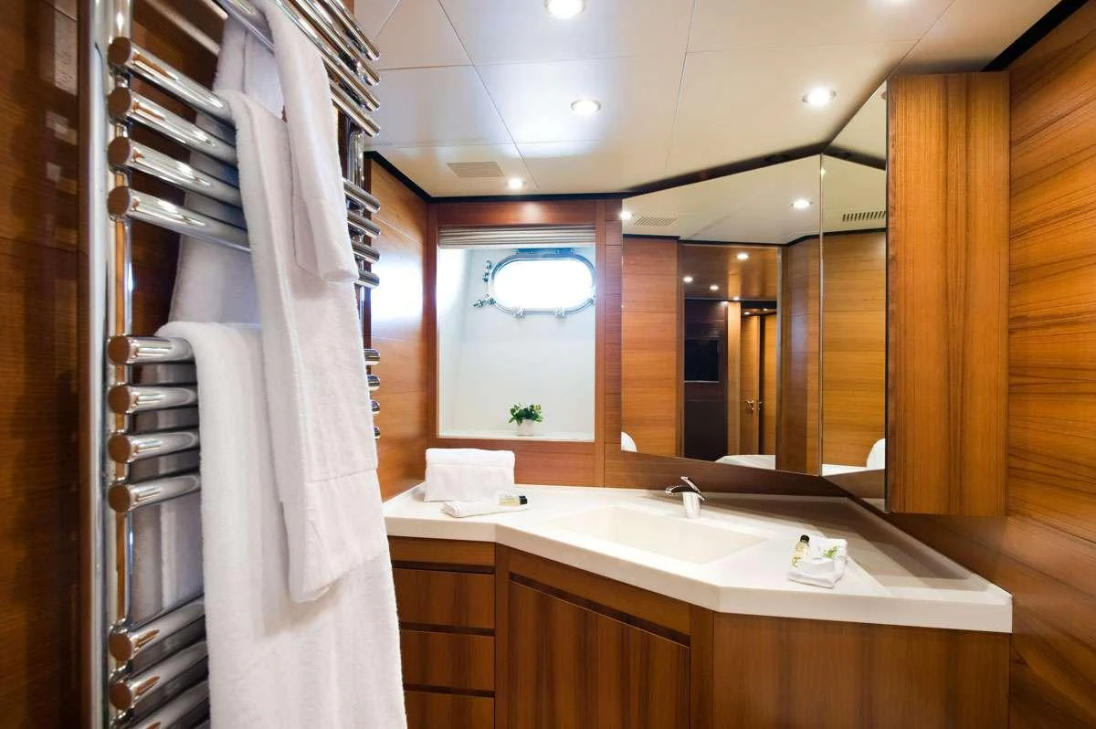 a bathroom with a large mirror aboard LOANA Yacht for Charter
