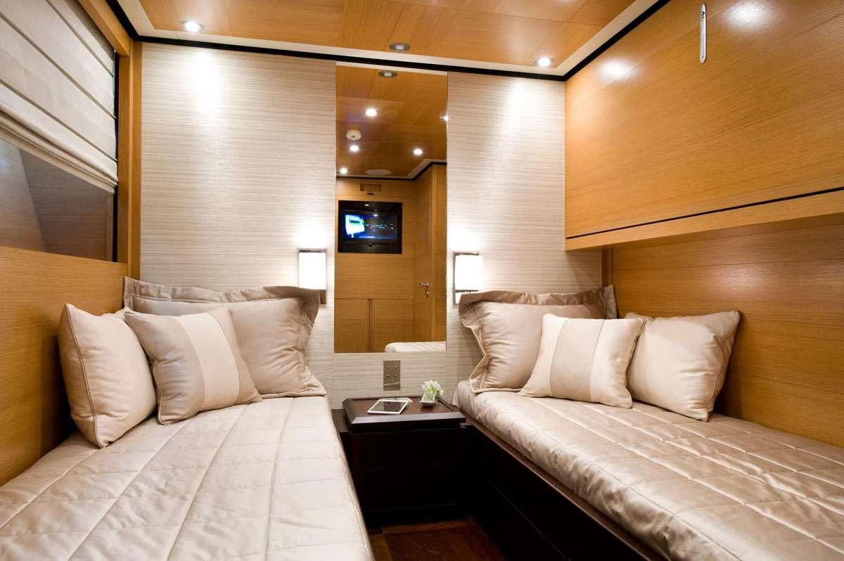 a room with two beds aboard LOANA Yacht for Charter