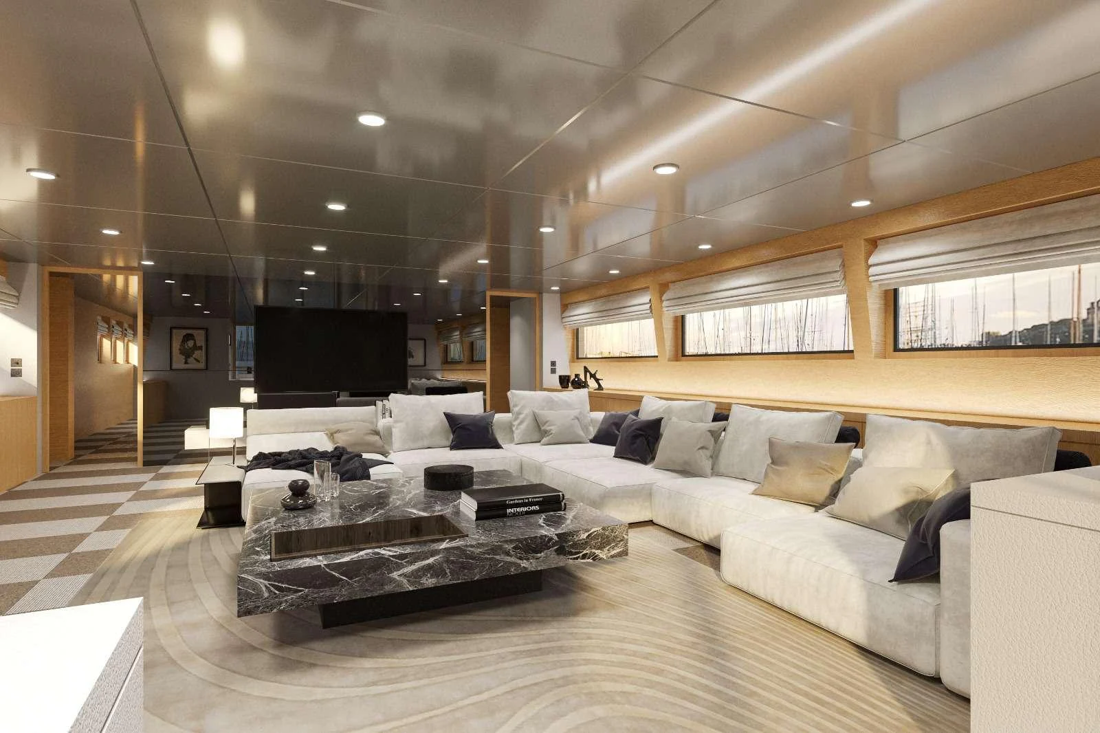 a large living room with a large sectional sofa and a tv aboard LOANA Yacht for Charter