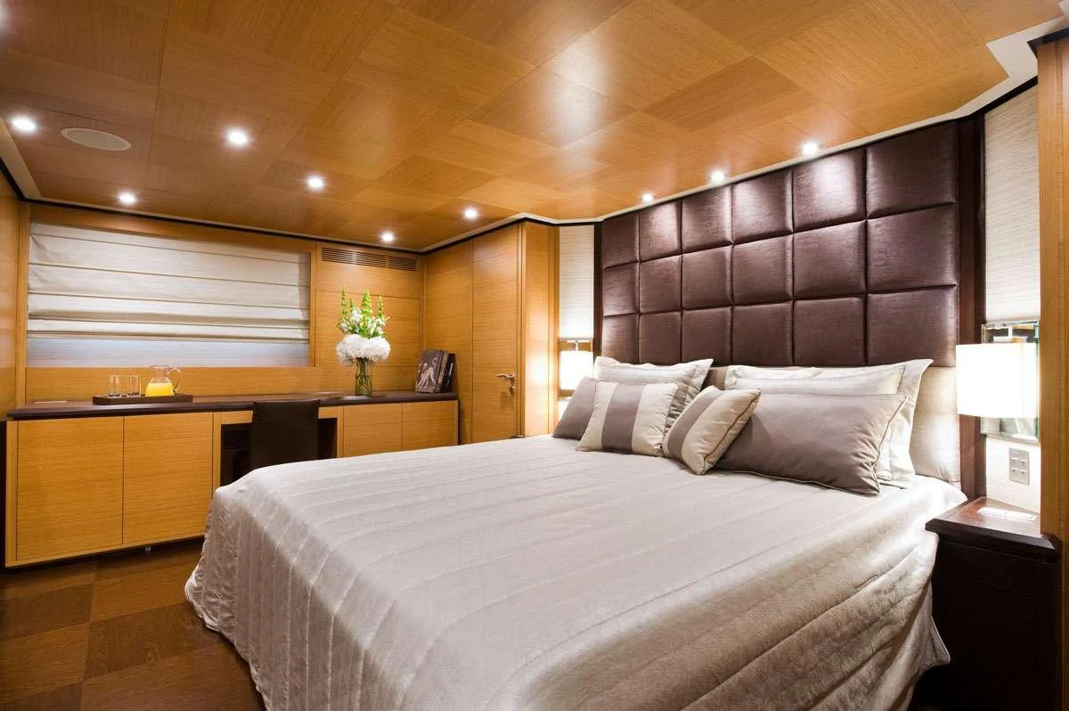 a bed in a room aboard LOANA Yacht for Charter