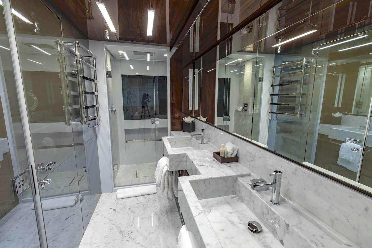 a bathroom with a large mirror aboard TASTY WAVES Yacht for Charter
