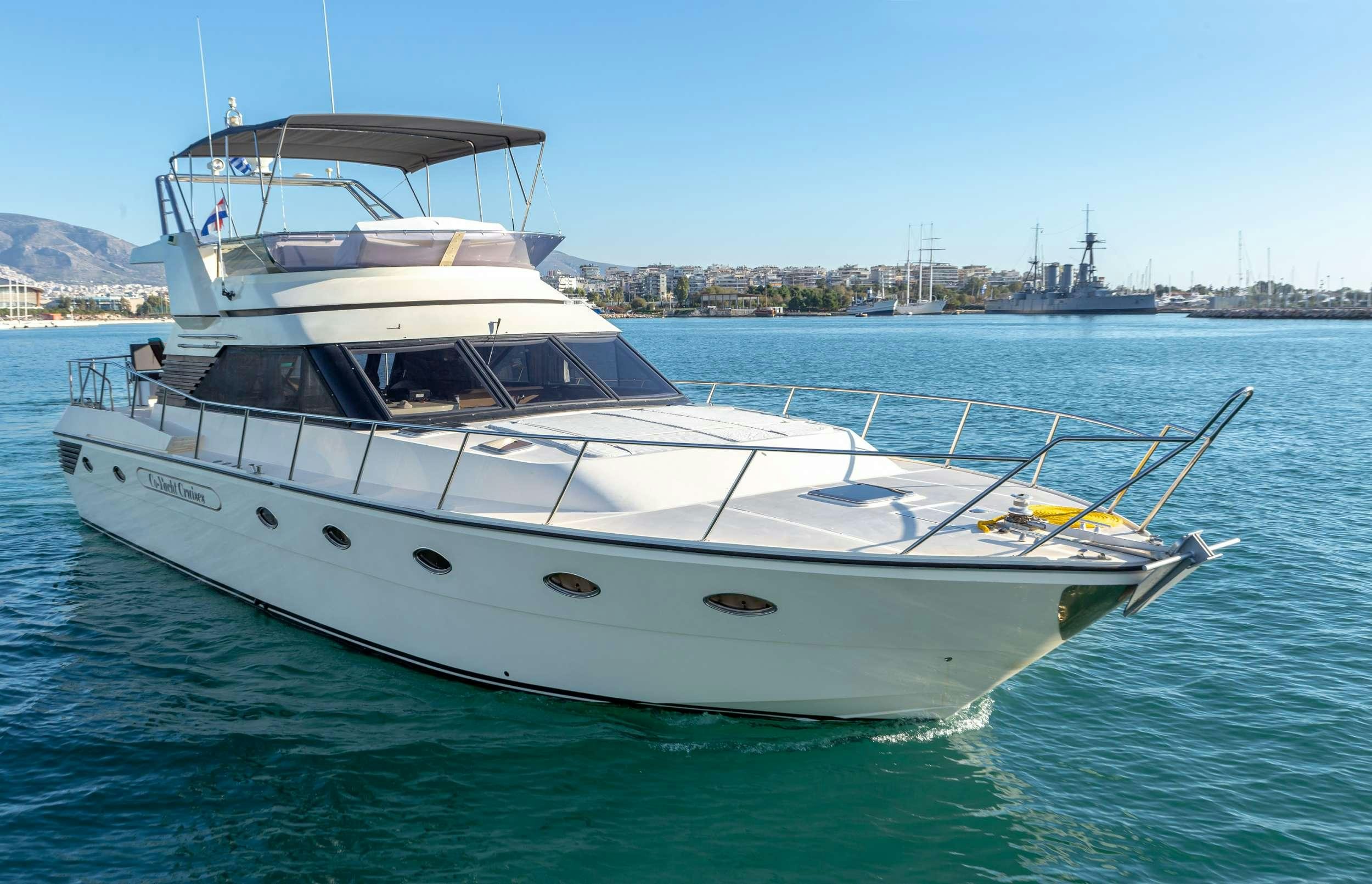 a white yacht in the water aboard Marios L Yacht for Charter