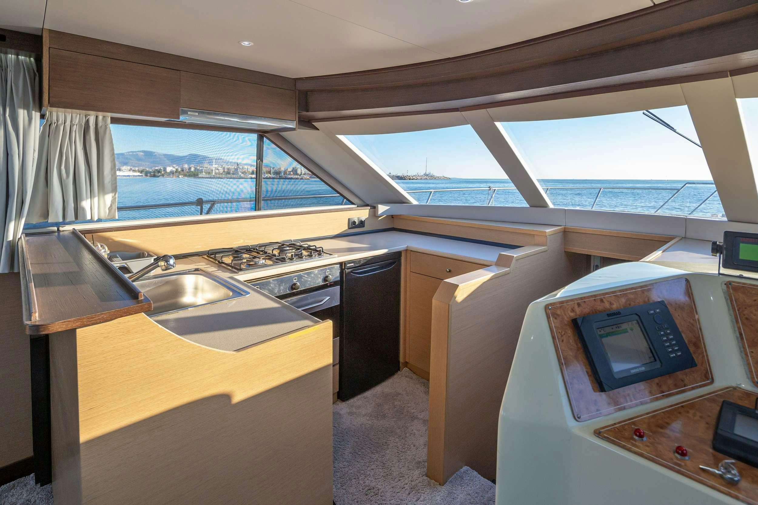 a kitchen with a microwave oven aboard Marios L Yacht for Charter