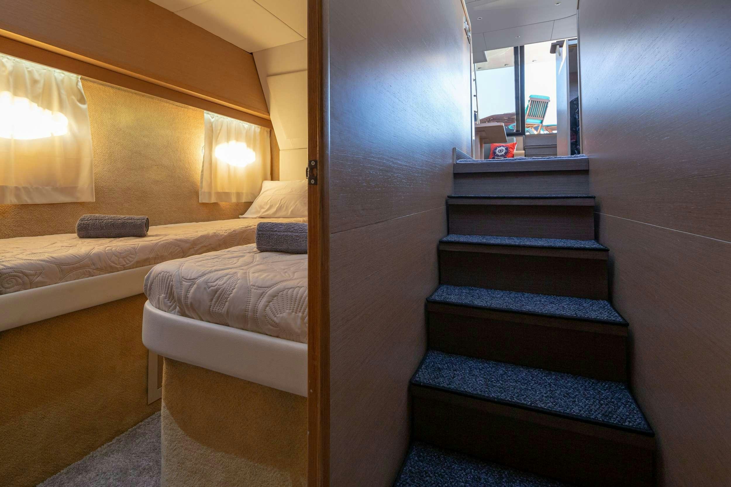 a room with a bed and a mirror aboard Marios L Yacht for Charter