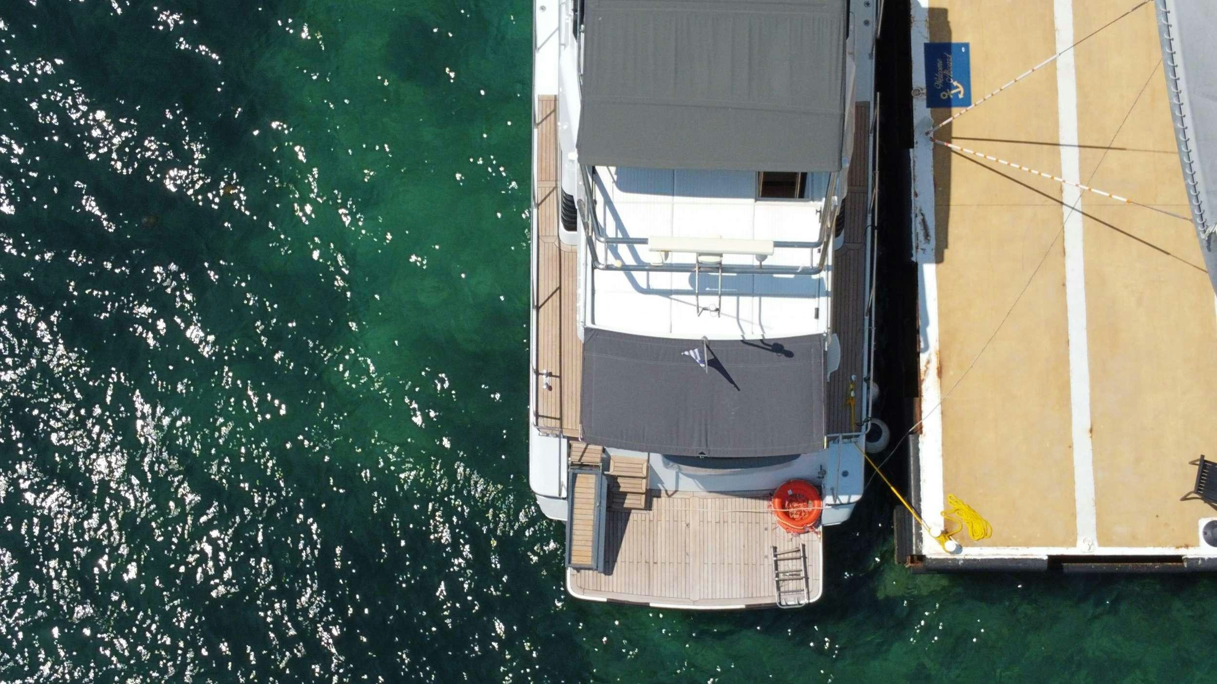 a tree with a car parked on it aboard Marios L Yacht for Charter
