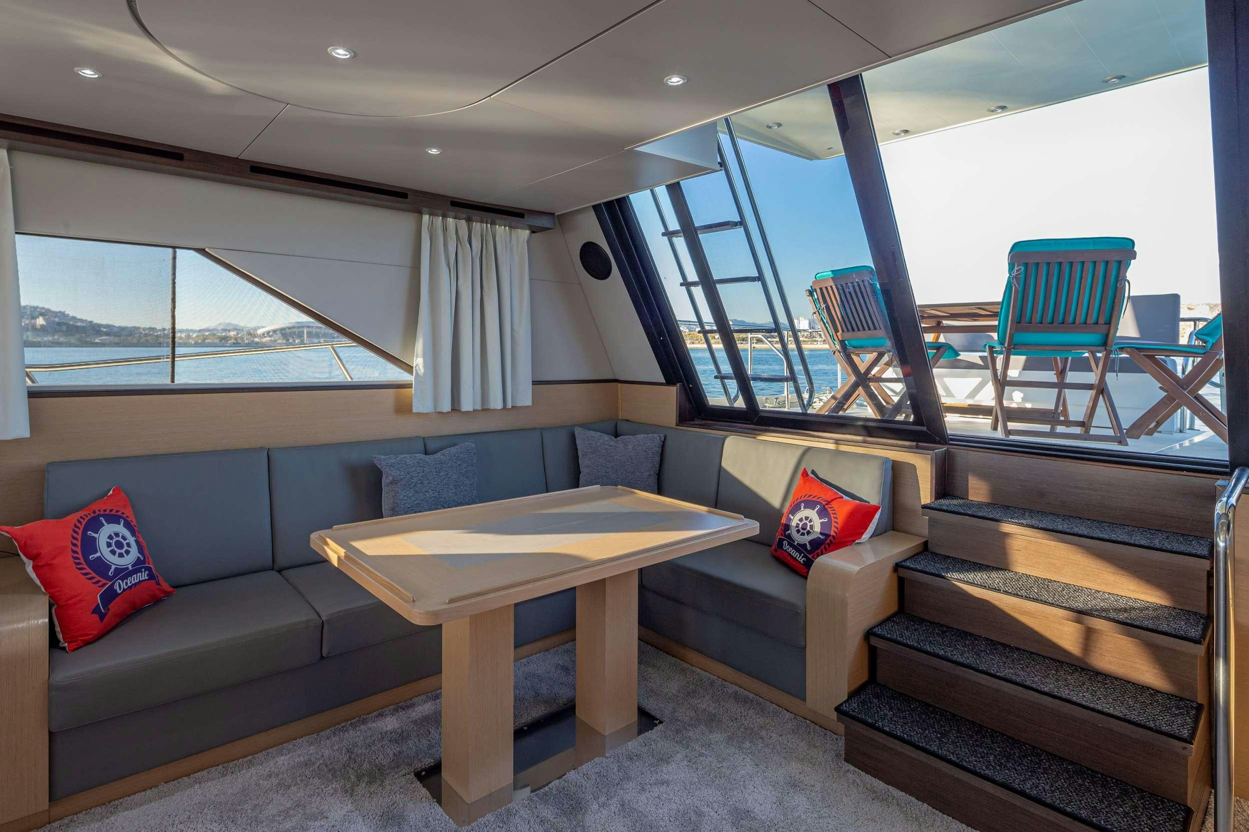 a living room with a couch and a table aboard Marios L Yacht for Charter