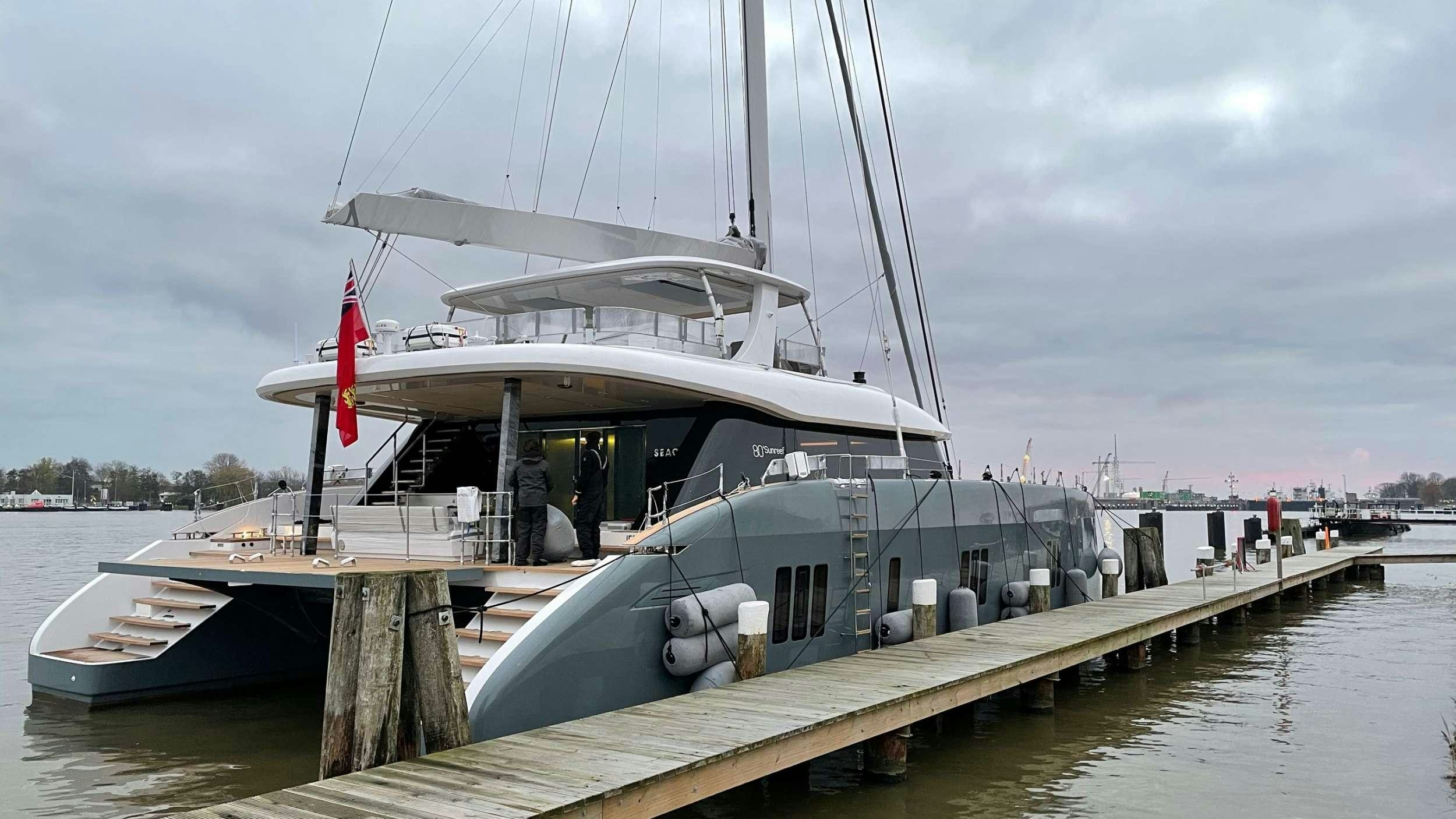 a boat docked at a pier aboard SEACLUSION Yacht for Charter