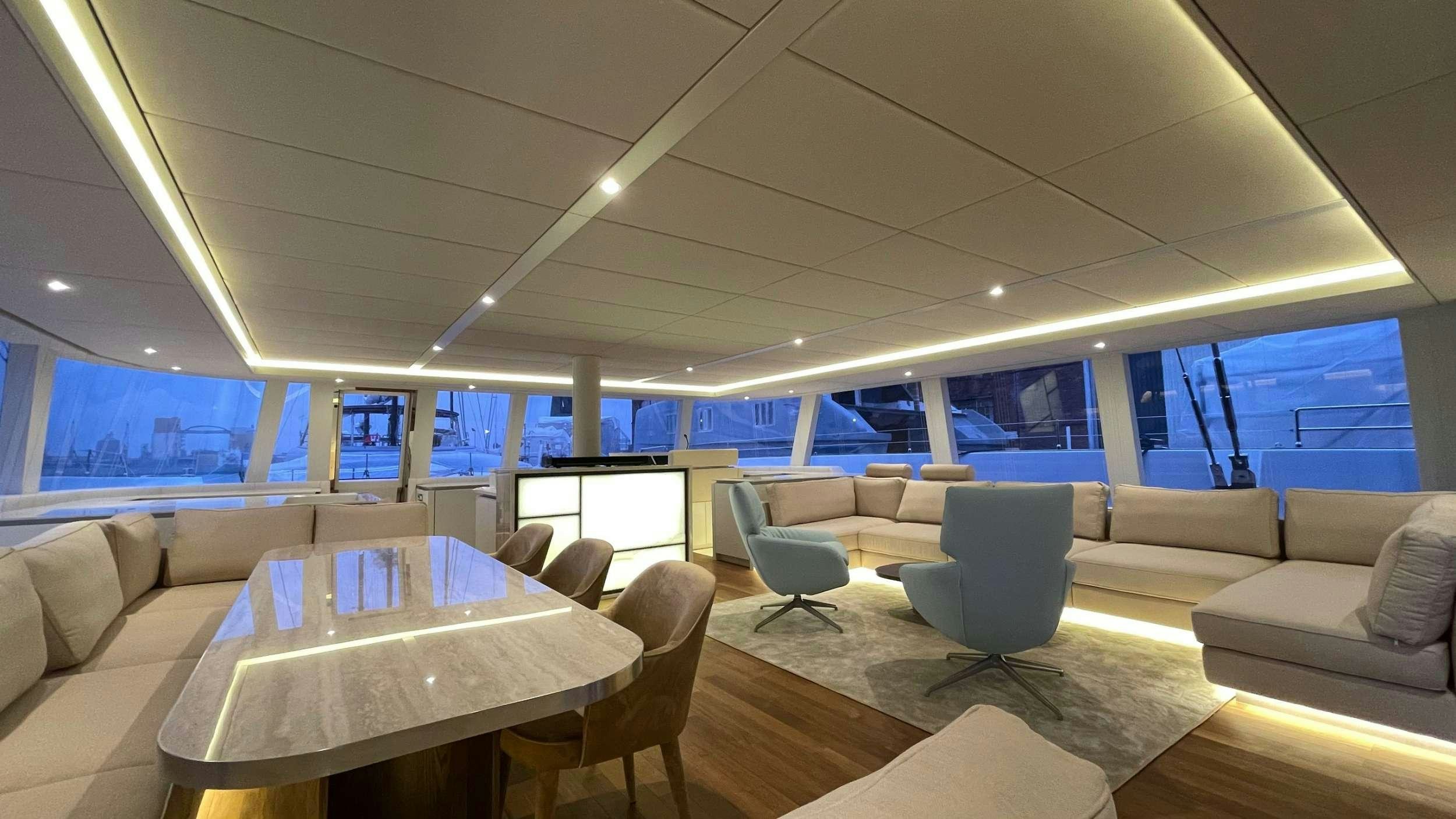 a room with a table and chairs aboard SEACLUSION Yacht for Charter