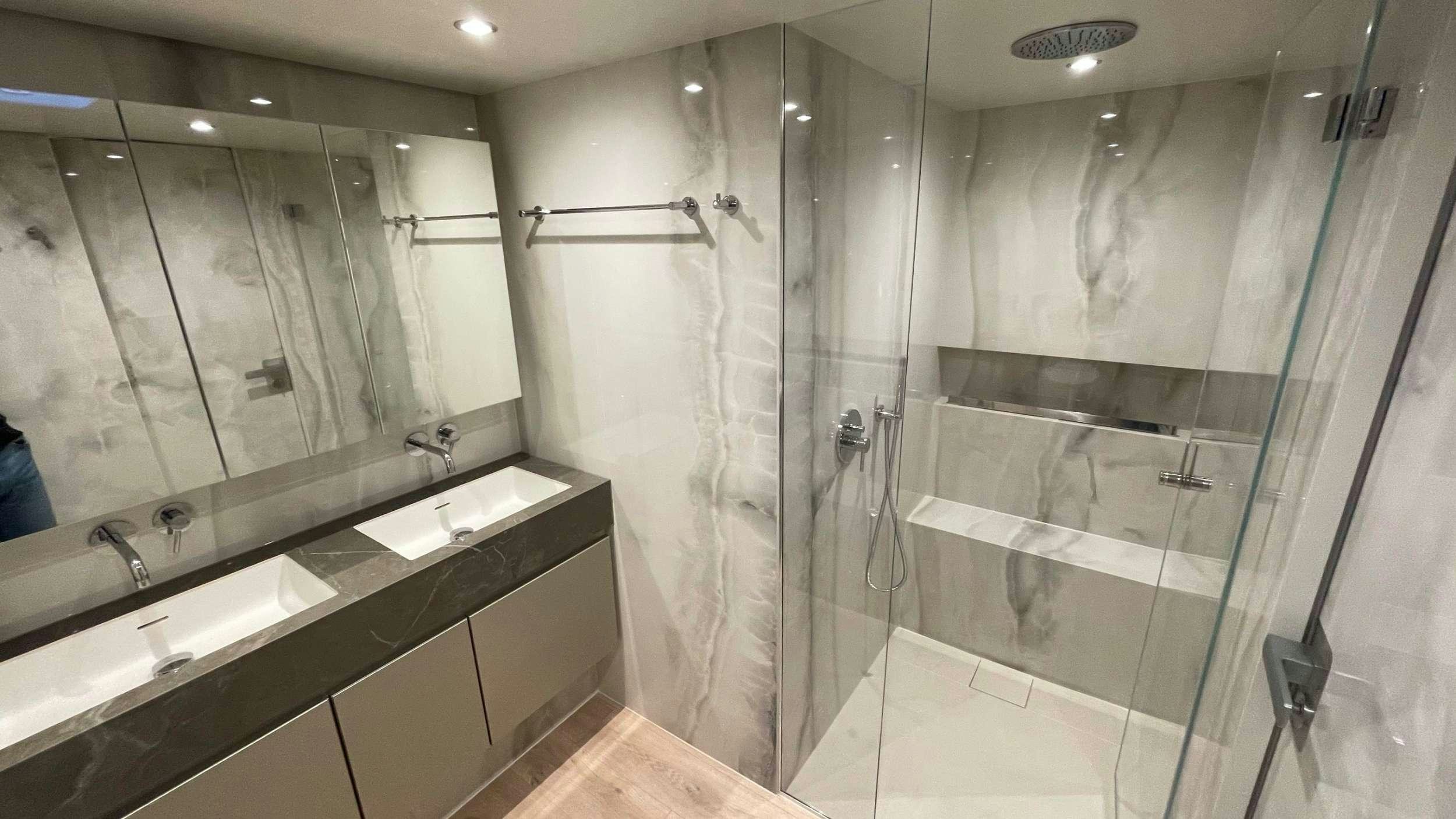 a bathroom with a large glass shower aboard SEACLUSION Yacht for Charter
