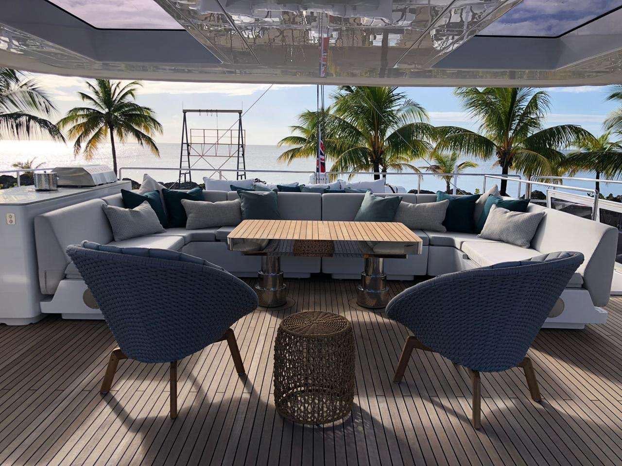 a room with a table and chairs aboard SEACLUSION Yacht for Charter