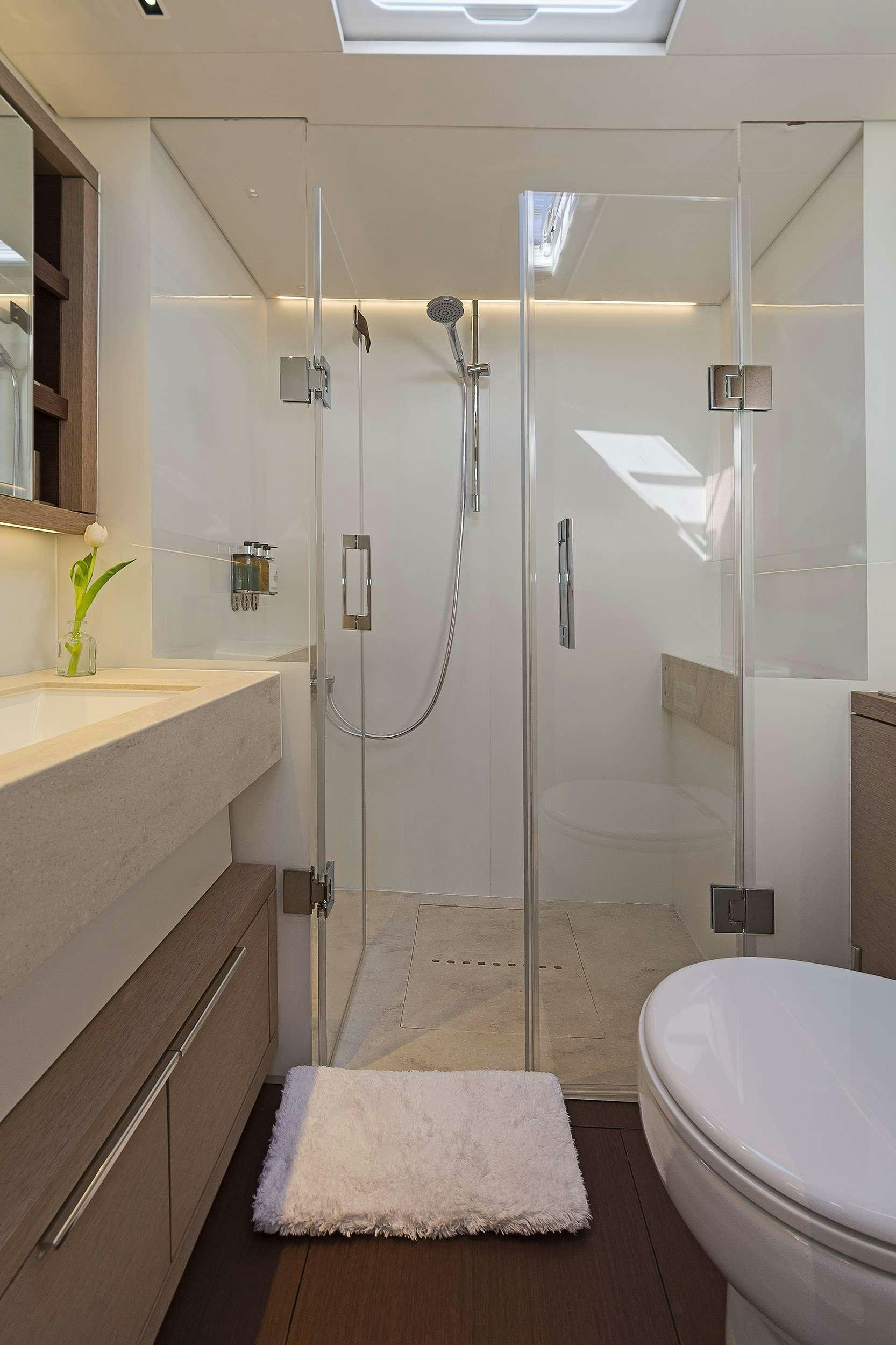 a bathroom with a shower unit aboard DAIQUIRI Yacht for Charter