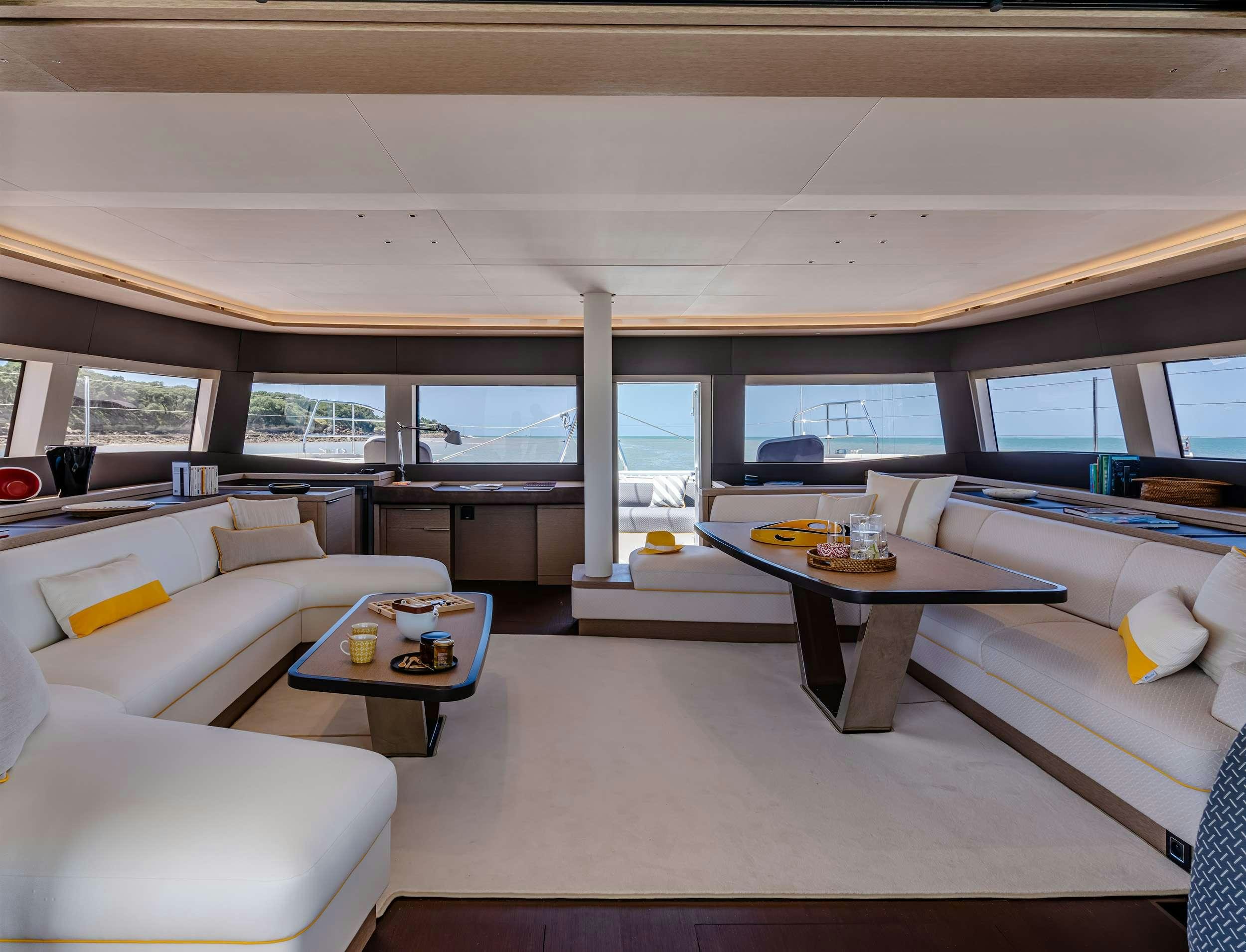 a room with a couch and a table aboard DAIQUIRI Yacht for Charter