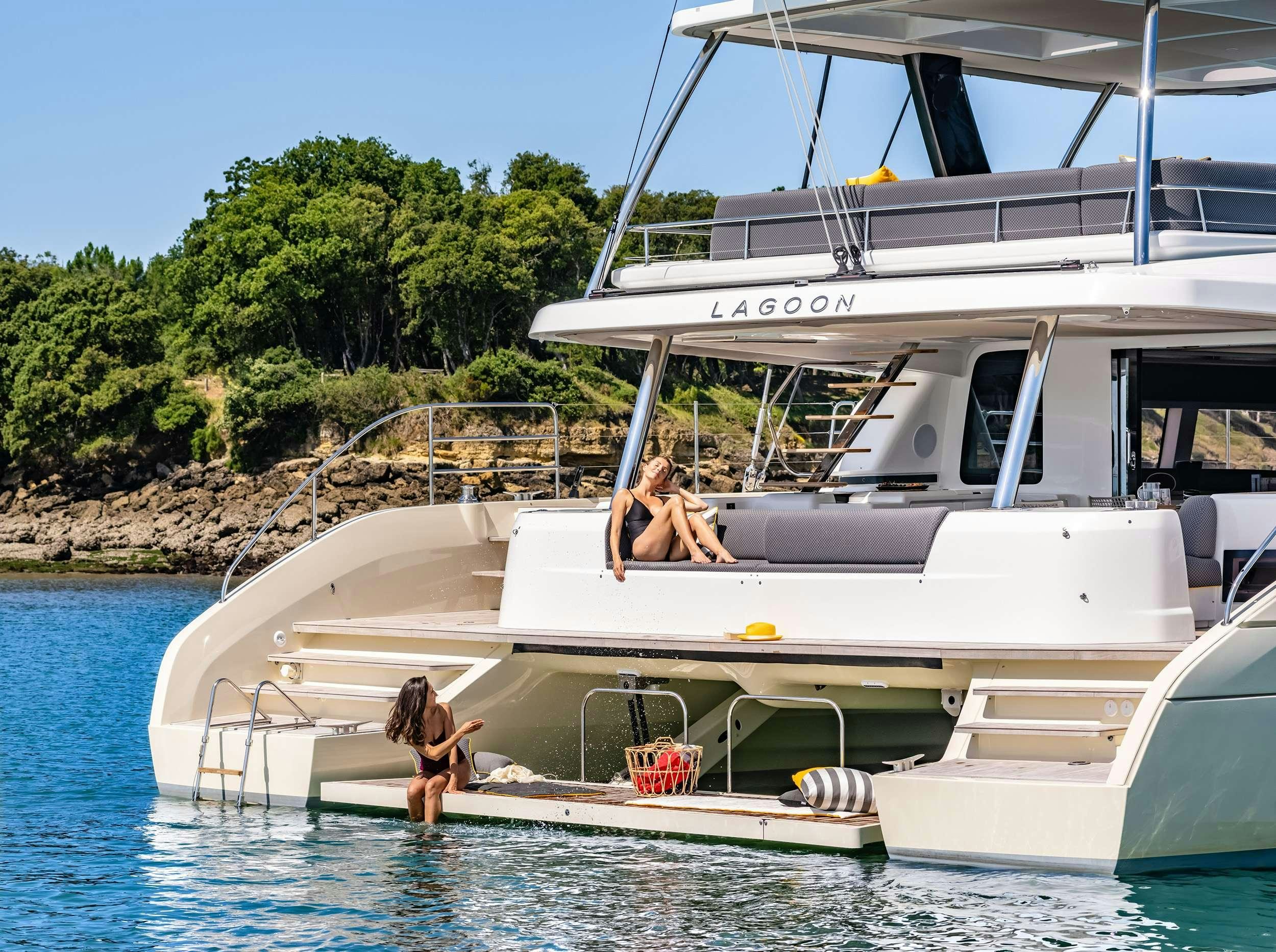 a couple of women sitting on a boat in the water aboard DAIQUIRI Yacht for Charter