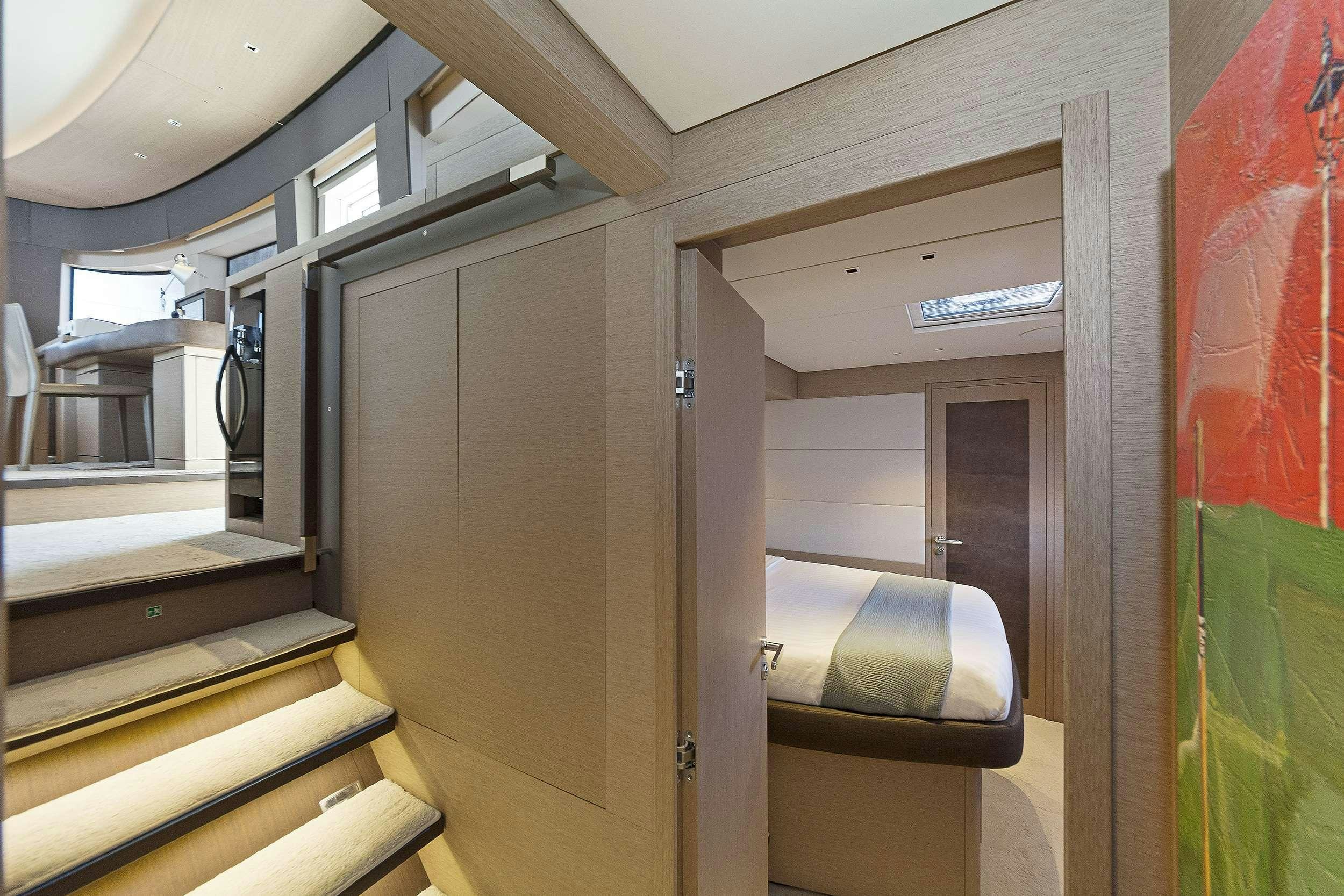 a room with a door and a chair aboard DAIQUIRI Yacht for Charter