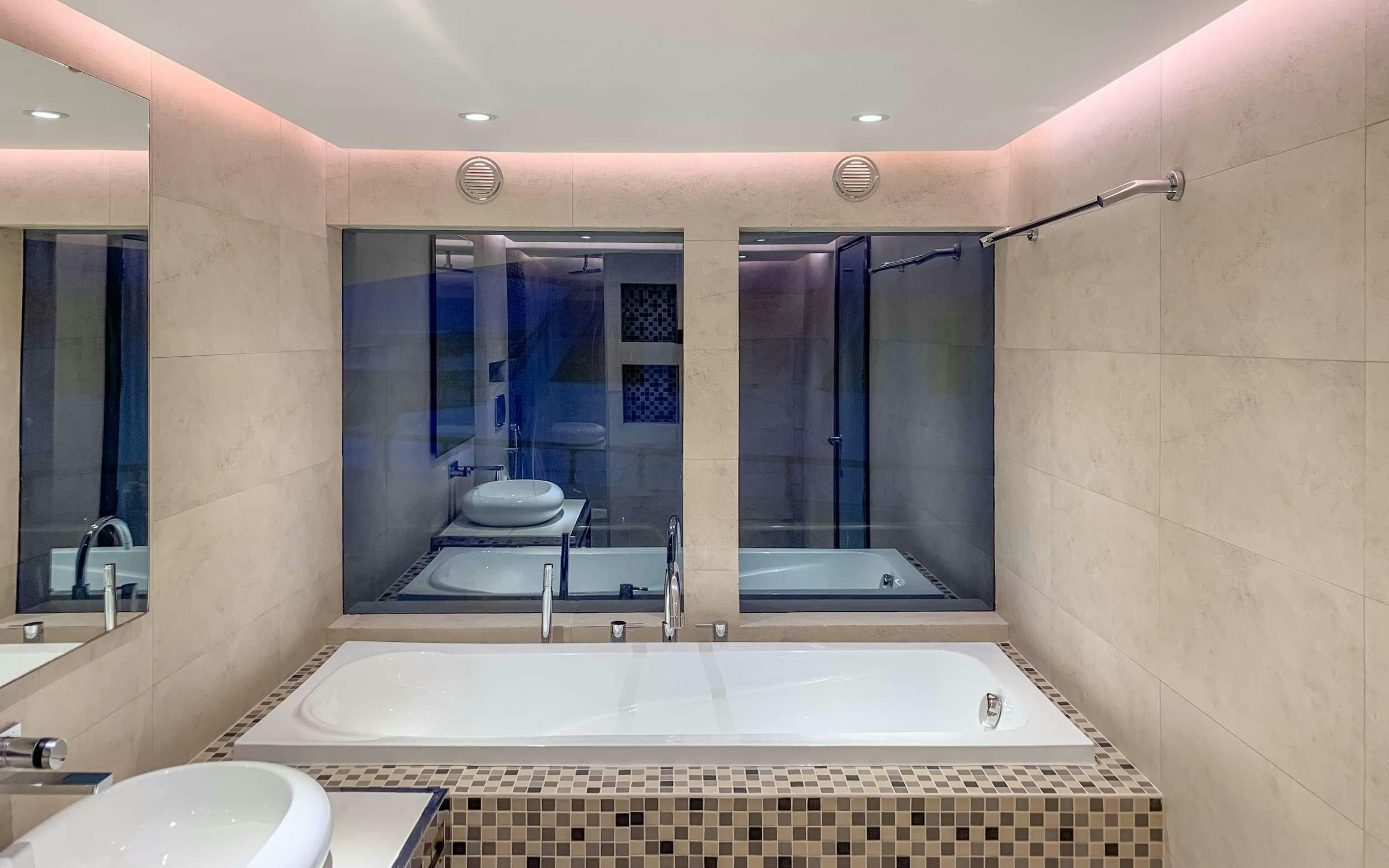 a bathroom with a large tub aboard ARK NOBLE Yacht for Charter