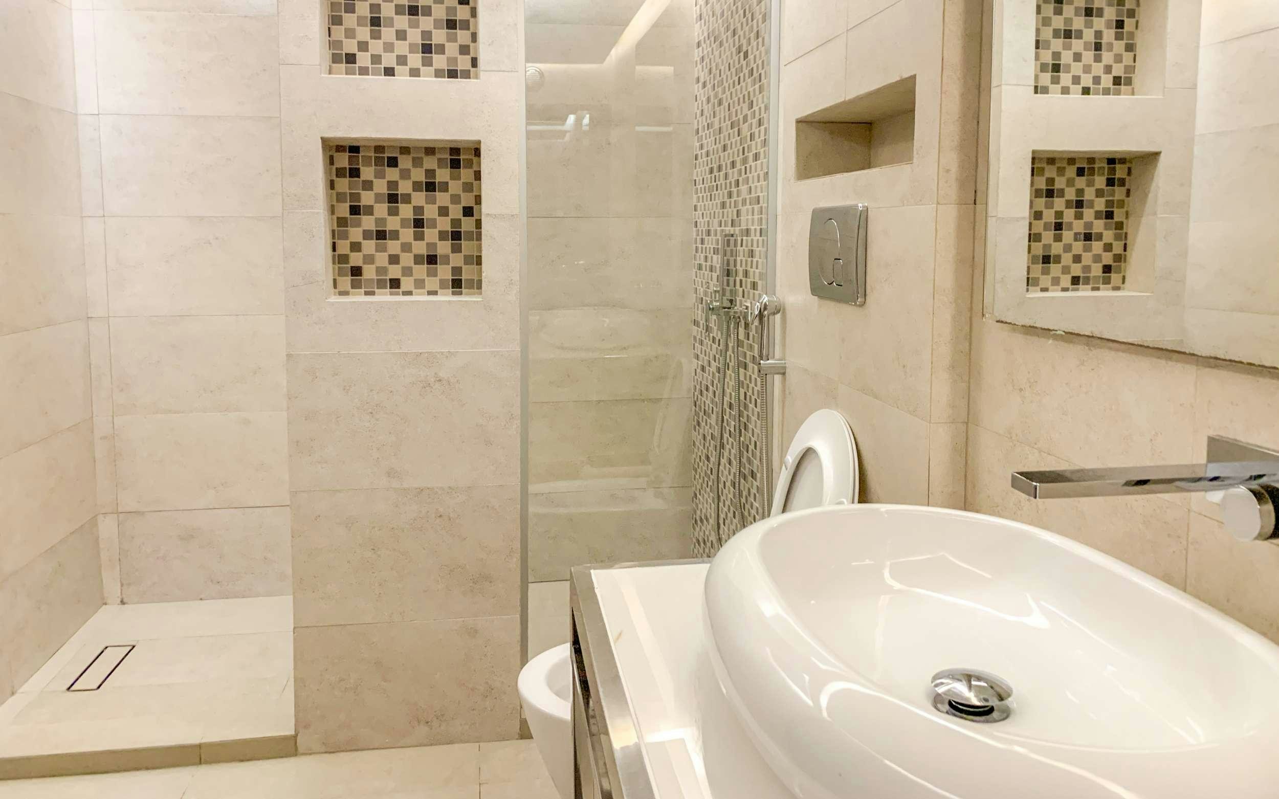 a bathroom with a sink and a shower aboard ARK NOBLE Yacht for Charter