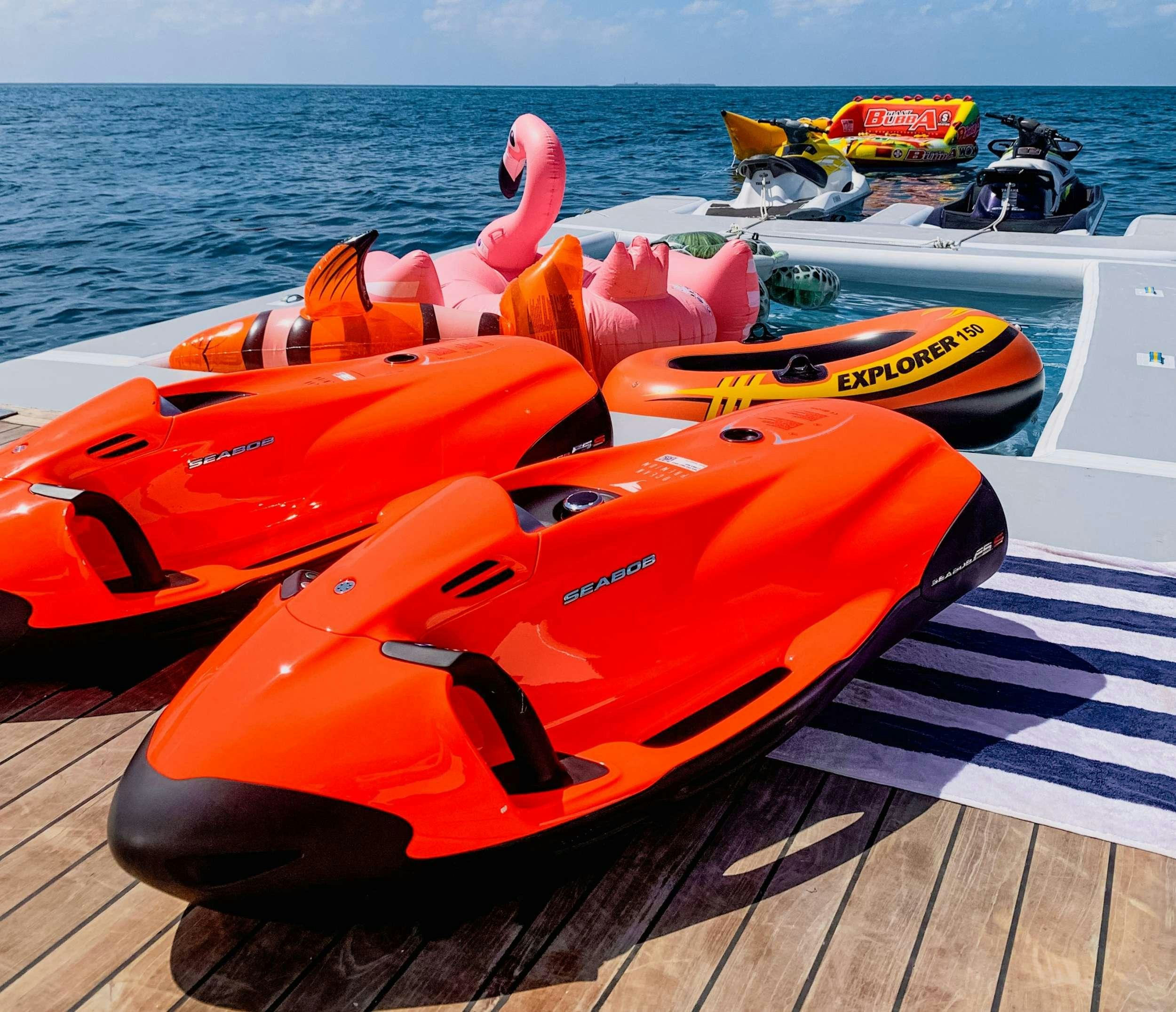a group of boats on a dock aboard ARK NOBLE Yacht for Charter