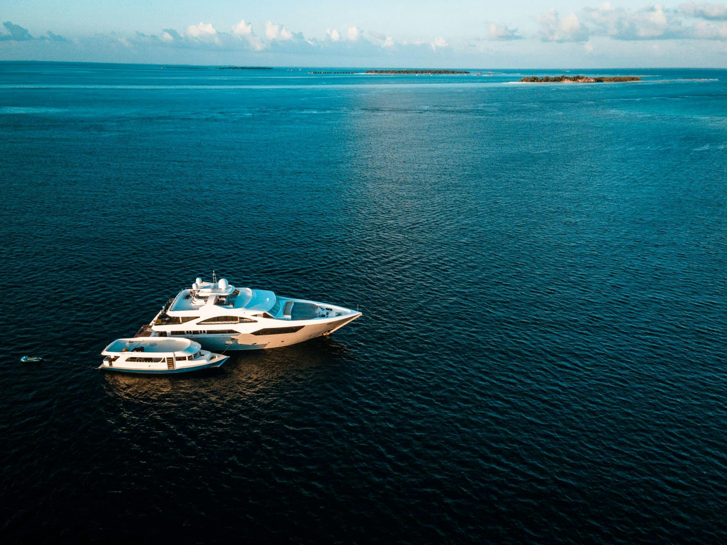 a couple of boats in the water aboard ARK NOBLE Yacht for Charter