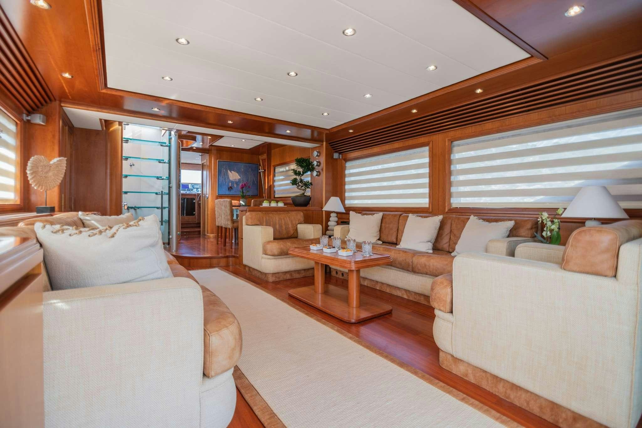 a living room with a large window aboard SALTY Yacht for Charter