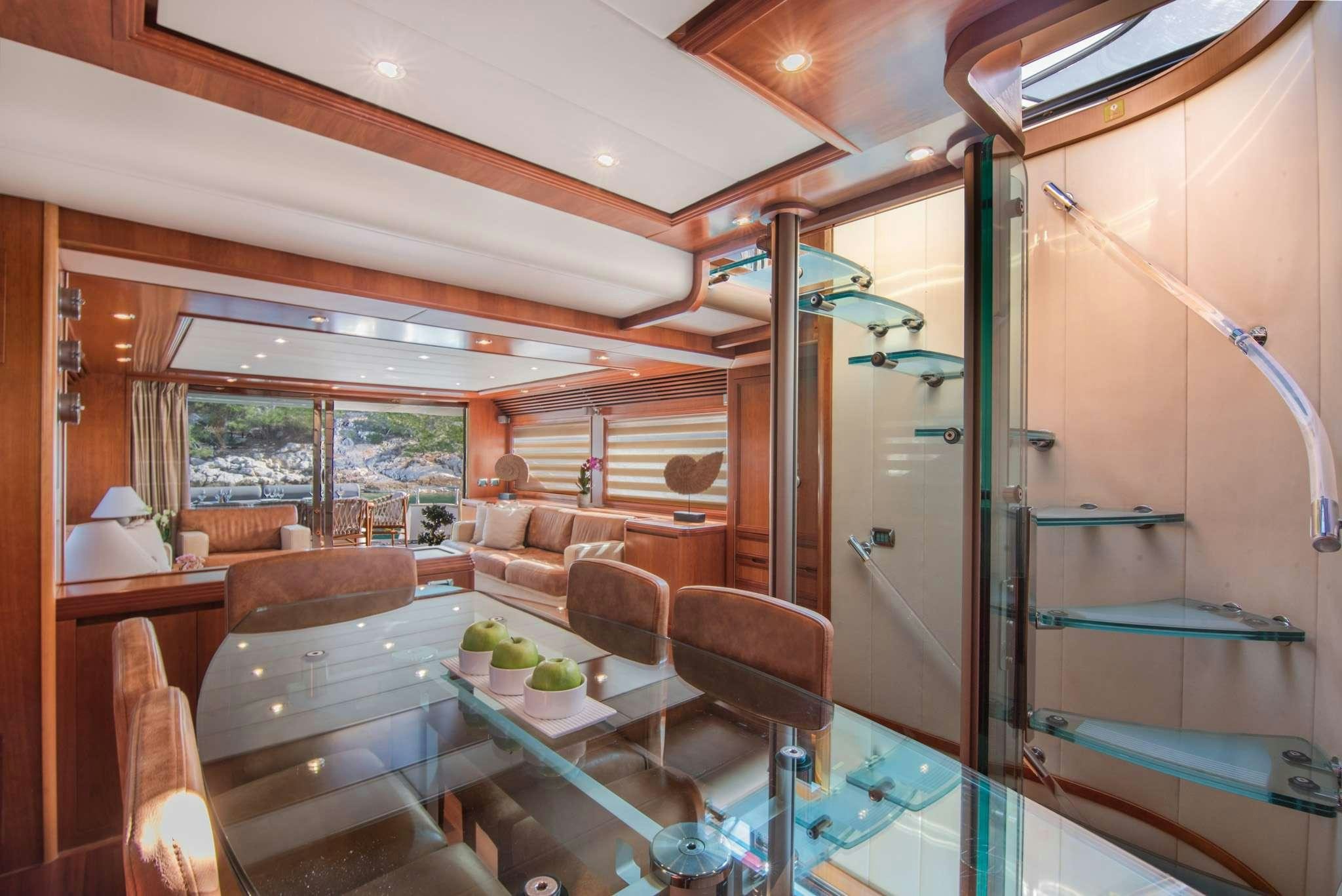 a living room with a glass wall aboard SALTY Yacht for Charter