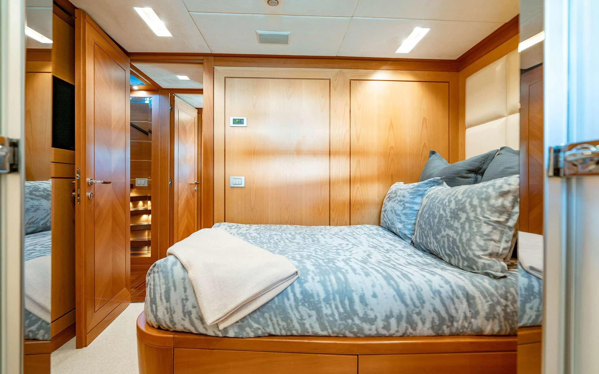 a bed in a room aboard WHY NOT Yacht for Charter