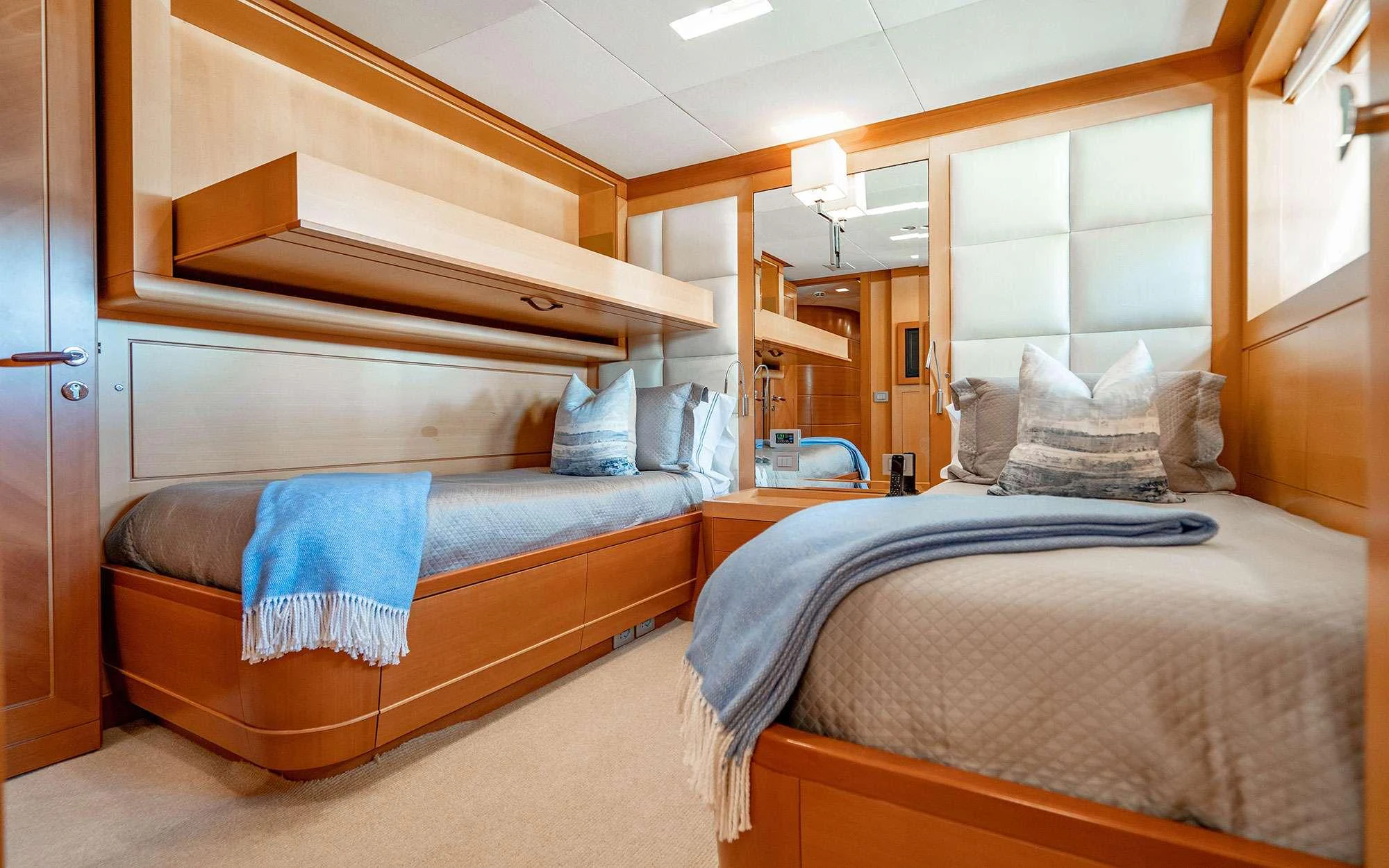 a couple of beds in a room aboard WHY NOT Yacht for Charter