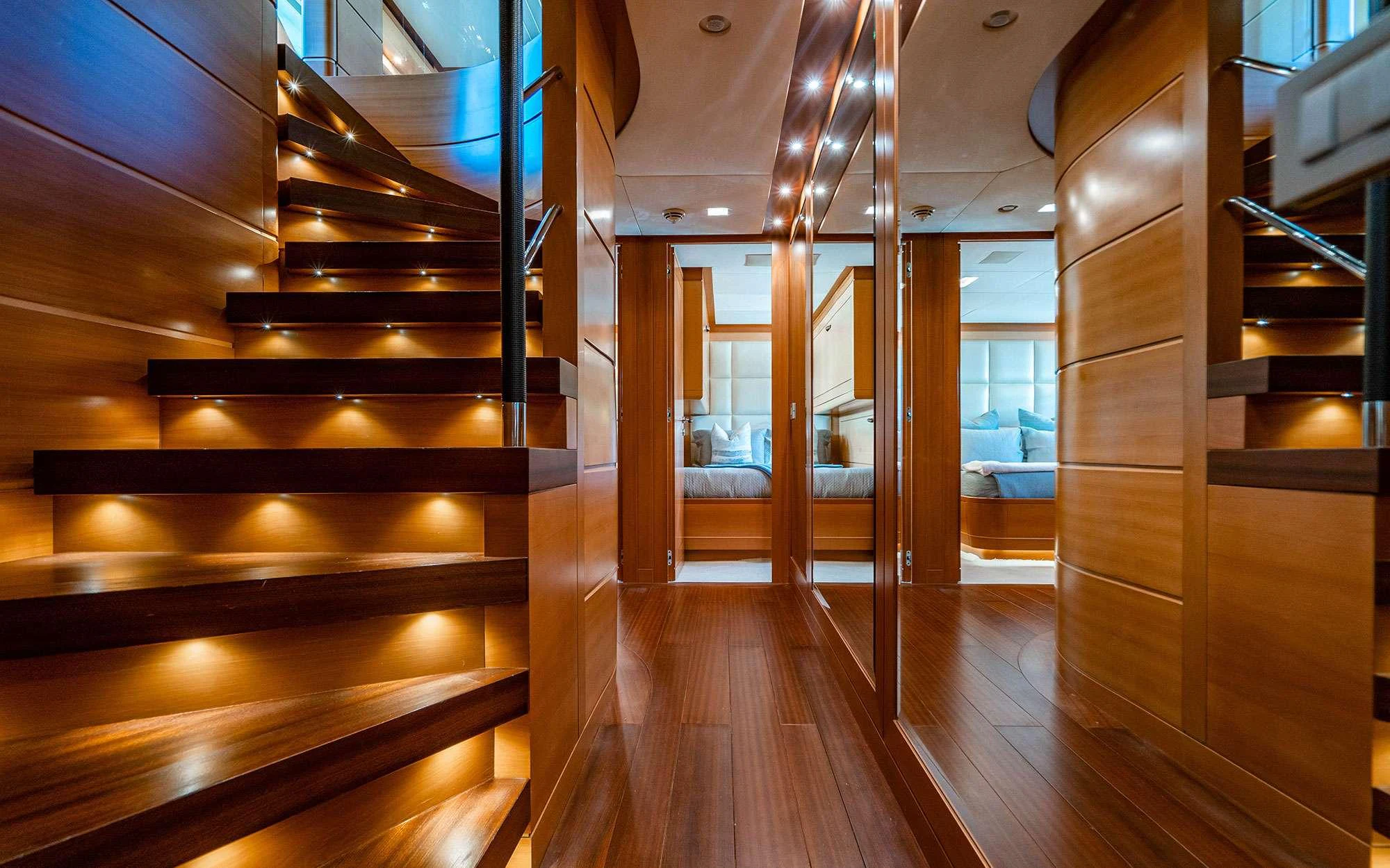 a wooden staircase in a house aboard WHY NOT Yacht for Charter